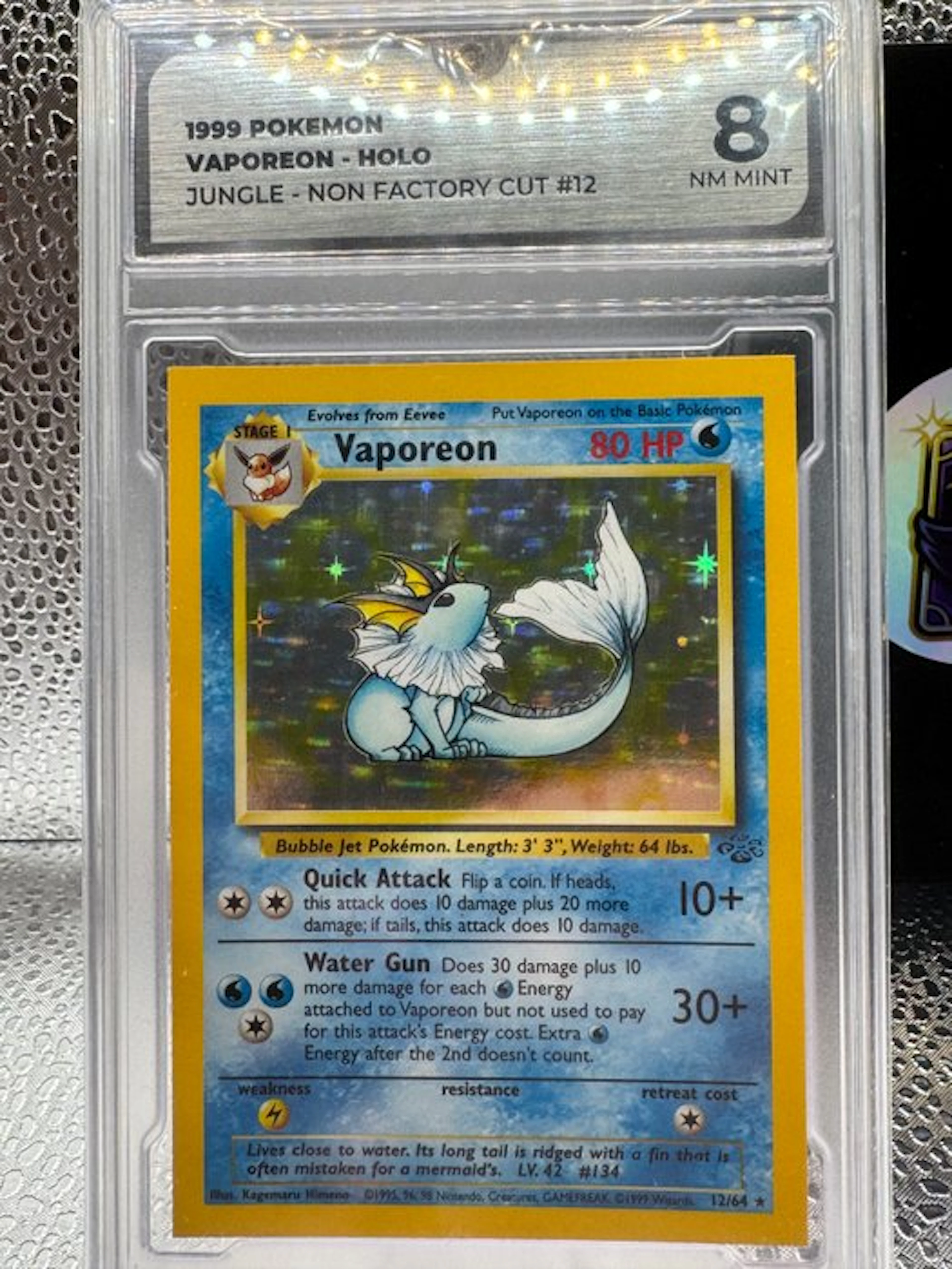 Pokémon - 1 Graded card - Vaporeon Non Factory Cut 12 Holo - GG 8 - WOTC