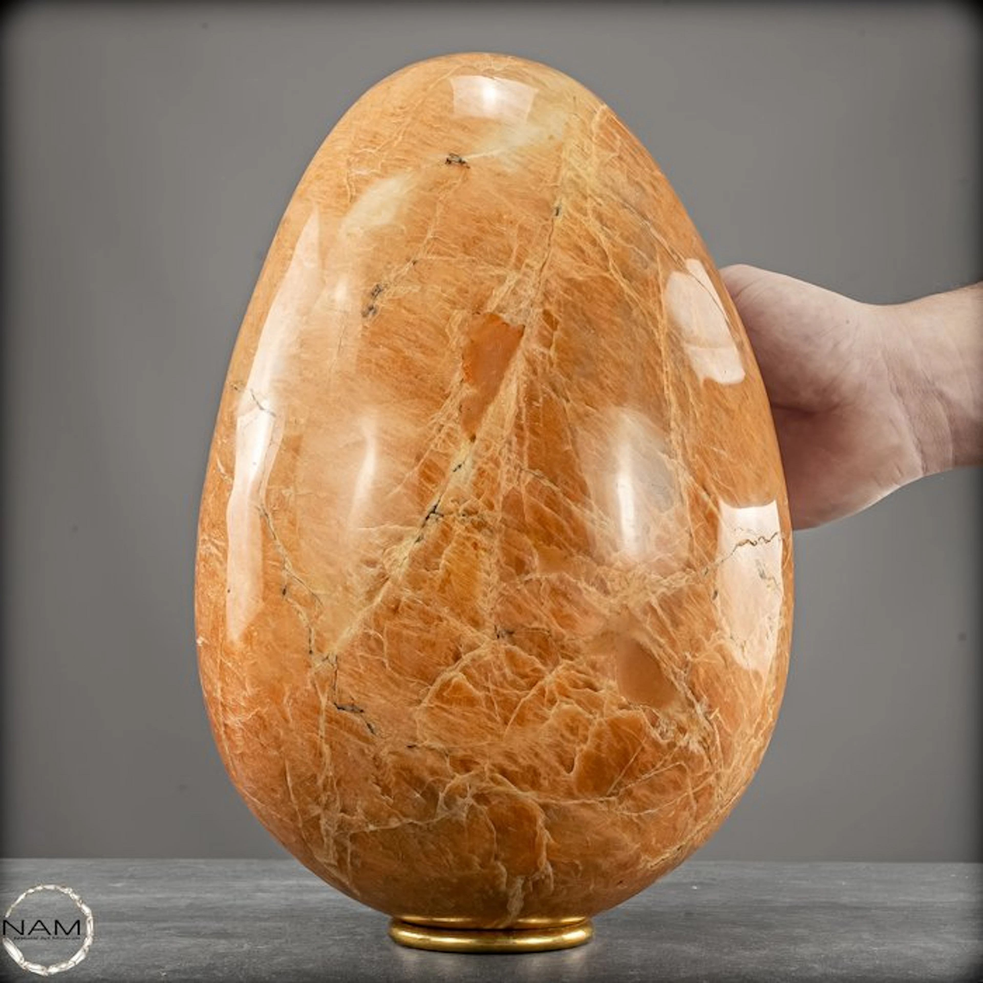 Natural noble moonstone egg in a warm honey tone – a...