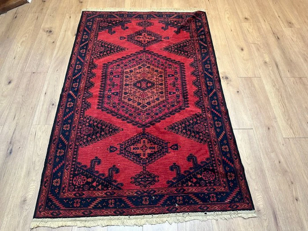 Hand-knotted Oriental rug in traditional Afghan style...