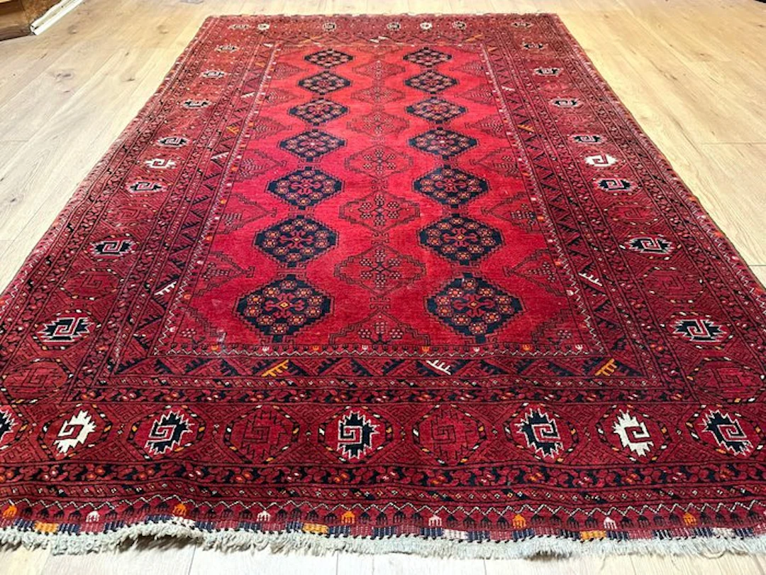 Classic hand-knotted Afghan Mauri rug with the characteristic Gul pattern