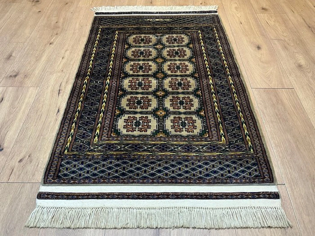 Hand-knotted Bukhara Oriental rug – Signed
