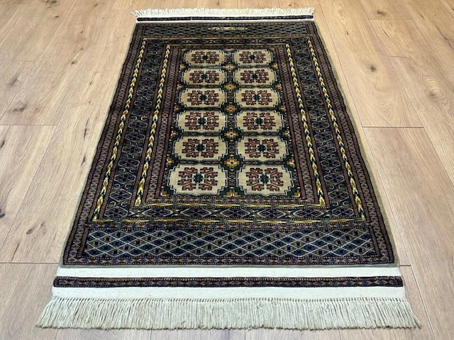 Hand-knotted Bukhara Oriental rug – Signed