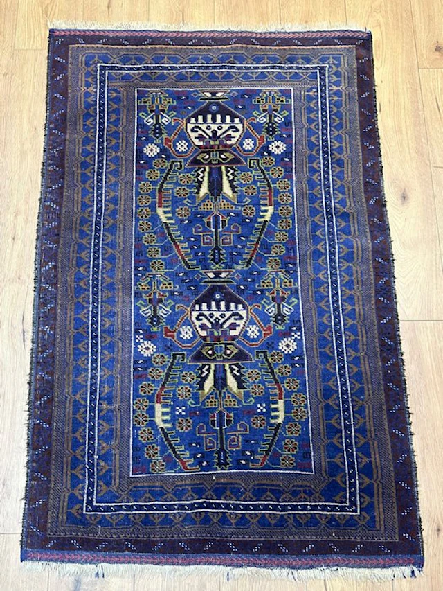 Hand-knotted Oriental rug in the traditional...