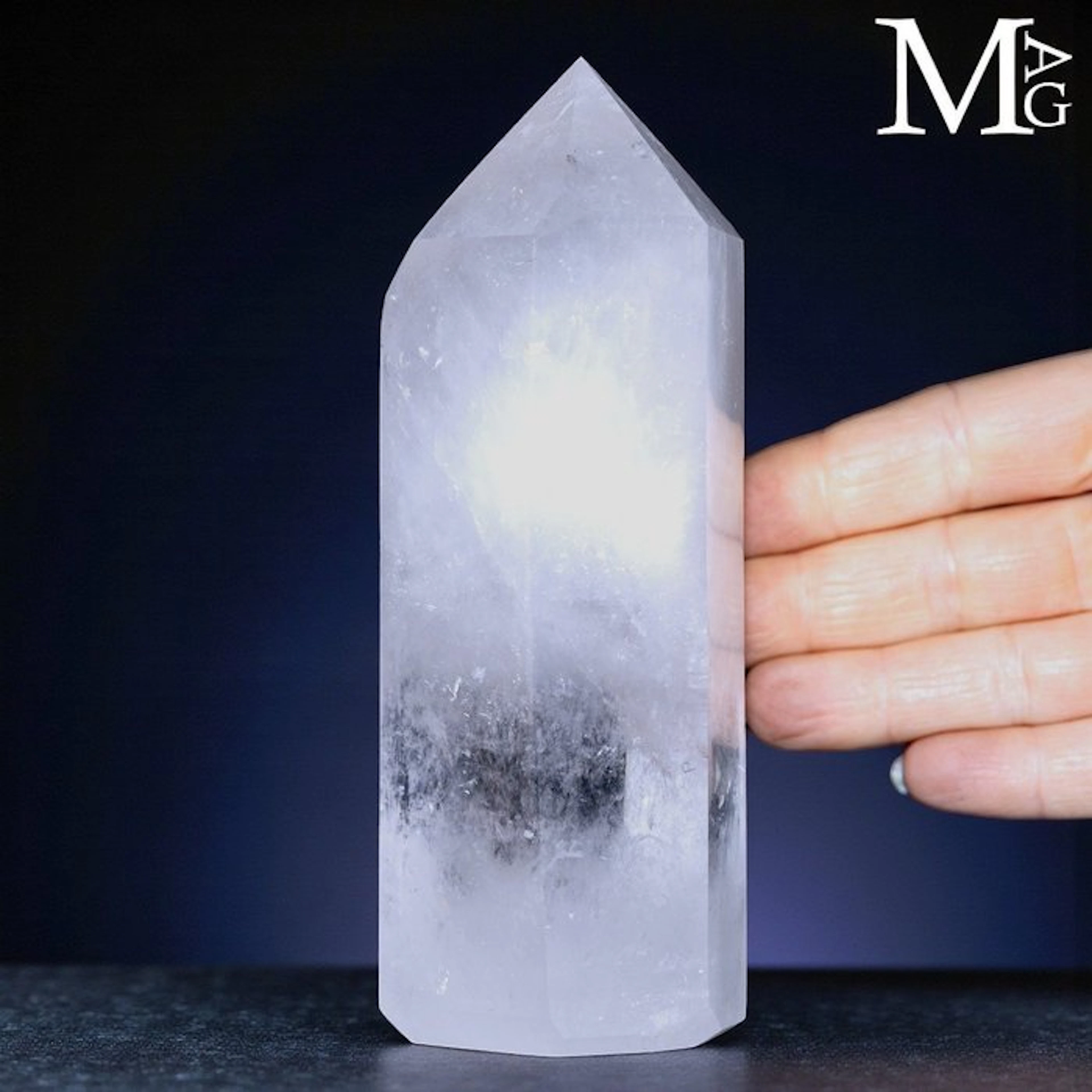 Clear quartz obelisk with intricate internal landscapes