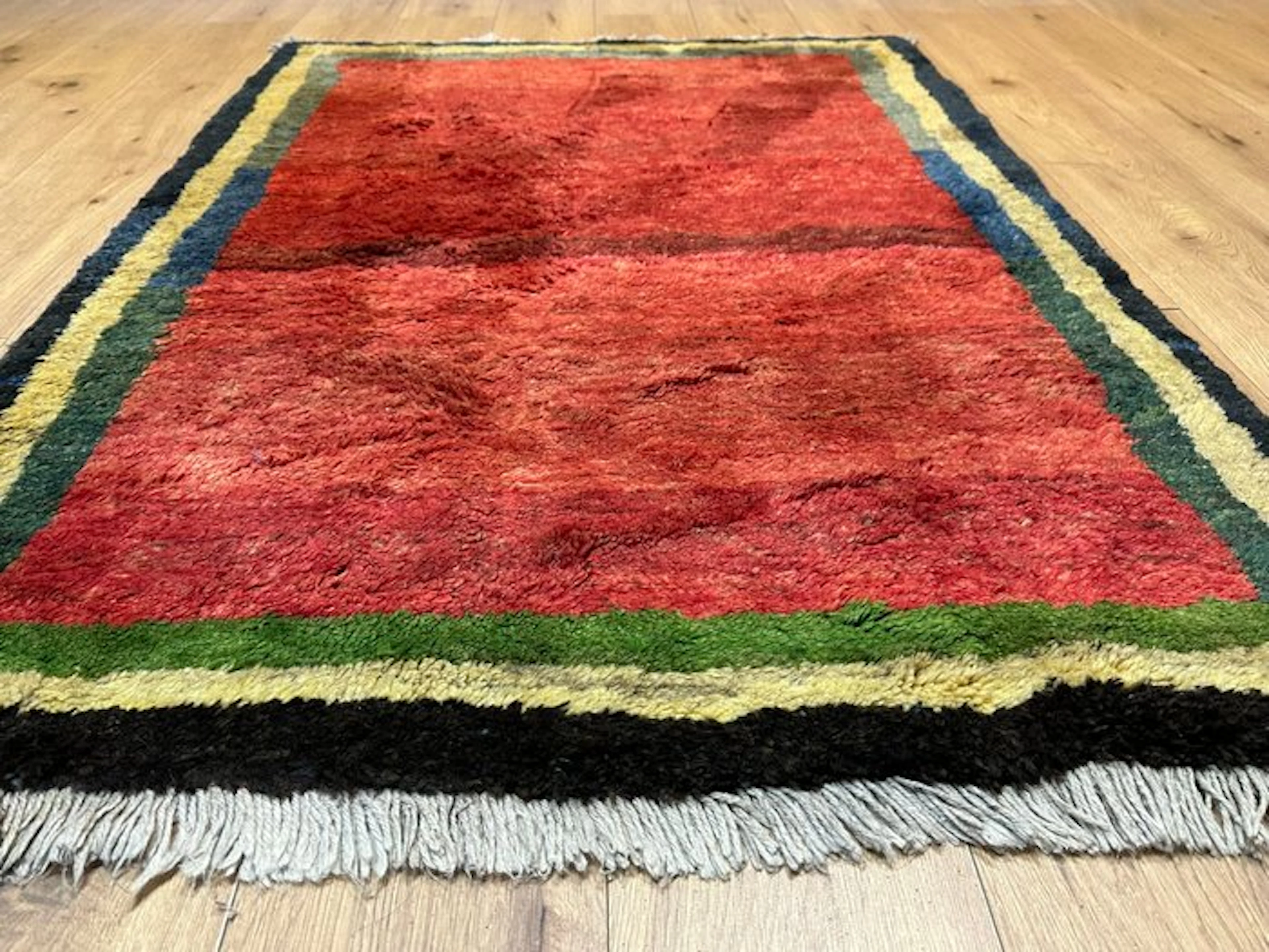 Beautiful Gabbeh rug with a rich field and a multicolored