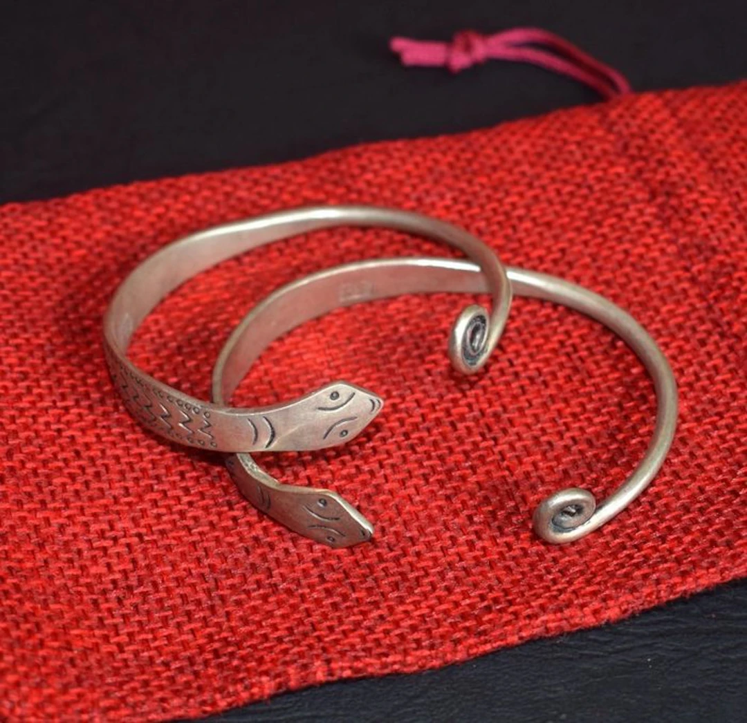Pair of two bracelets with a snake motif