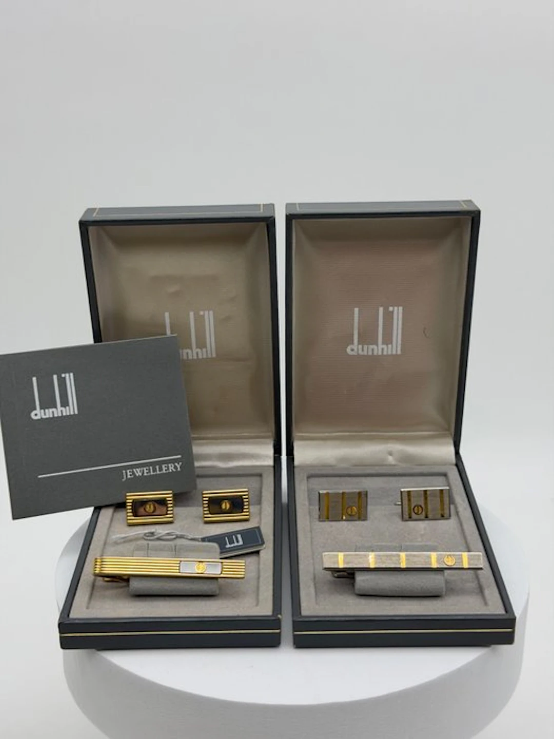 Alfred Dunhill - Metal, Gold-plated - Cufflinks - Two-piece set with boxes.