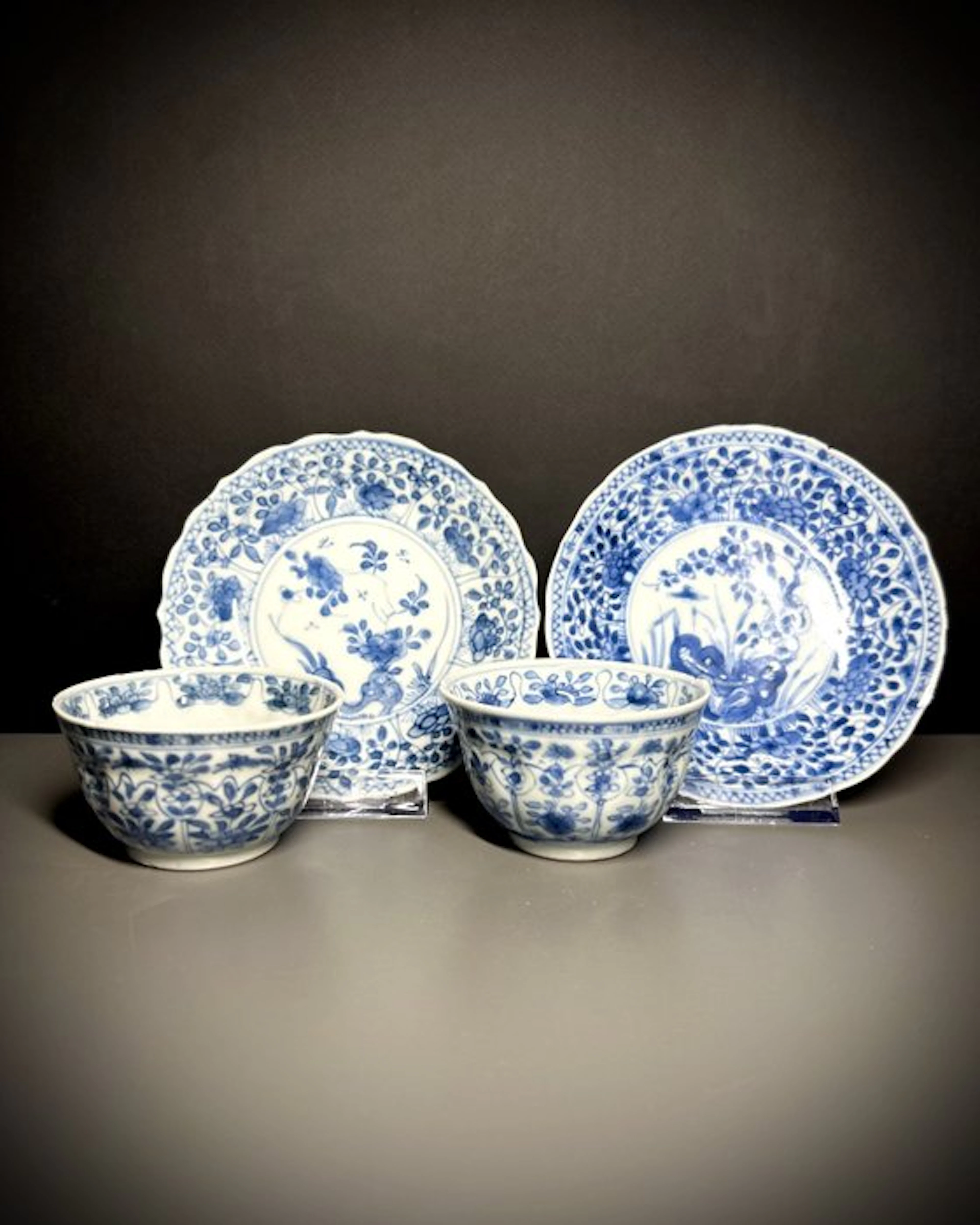 NO RESERVE - A PAIR OF CHINESE BLUE AND WHITE MOULDED CUPS & SAUCERS