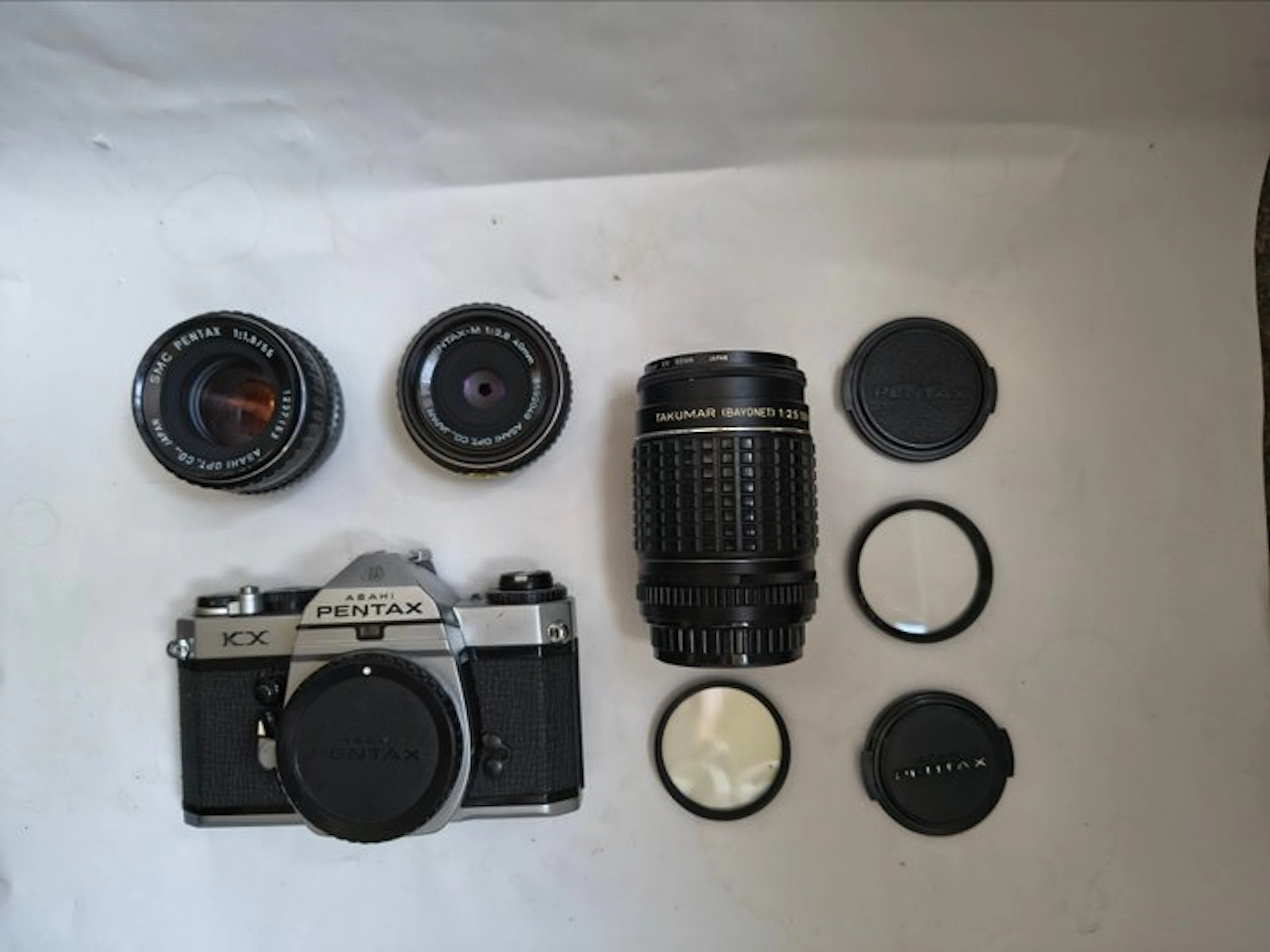 Pentax KX + SMC 1.8/55mm + Takumar 2.5/135mm + smc-M...