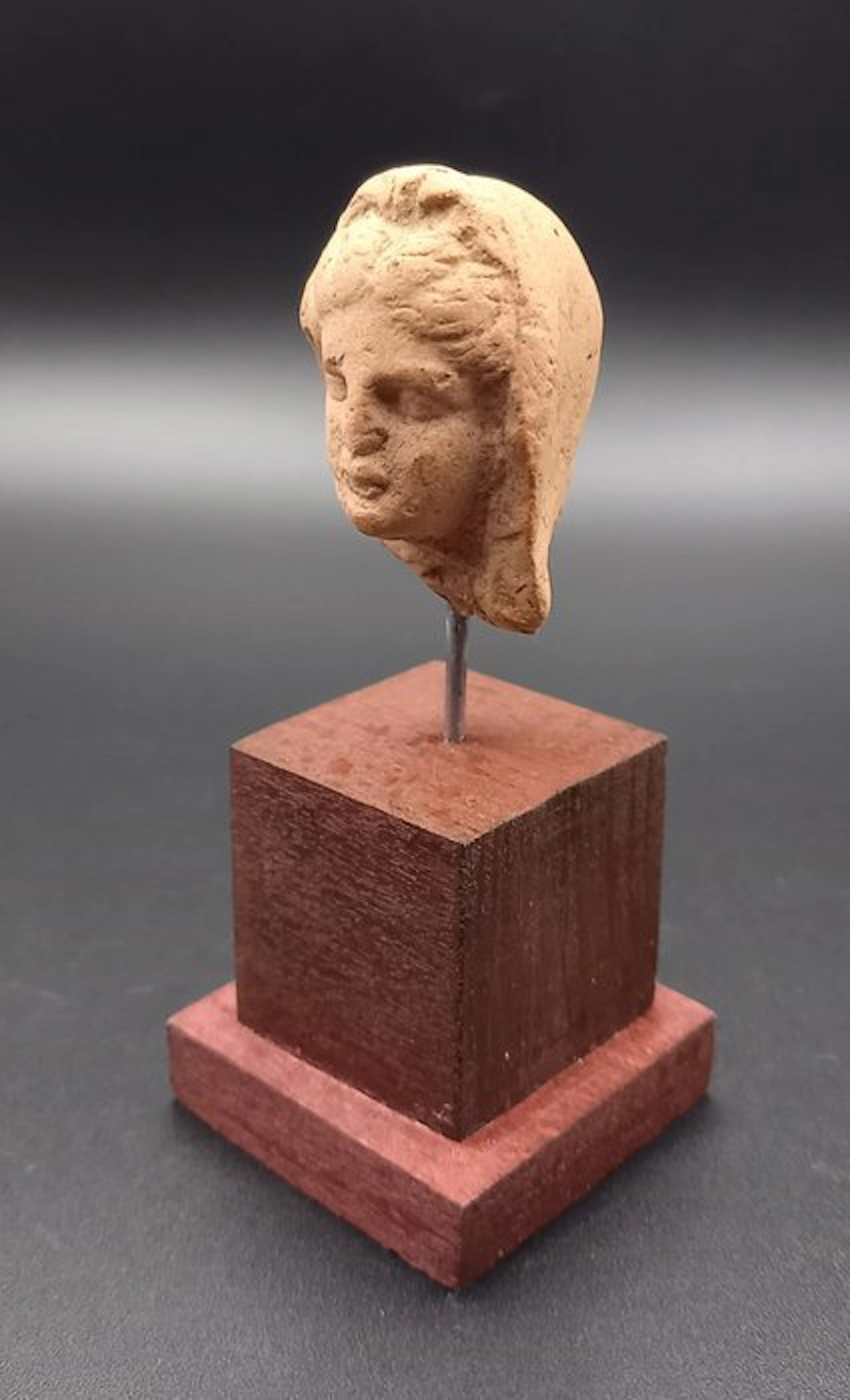 Ancient Greek, Hellenistic Terracotta Head of a woman wearing a veil. - 40 mm