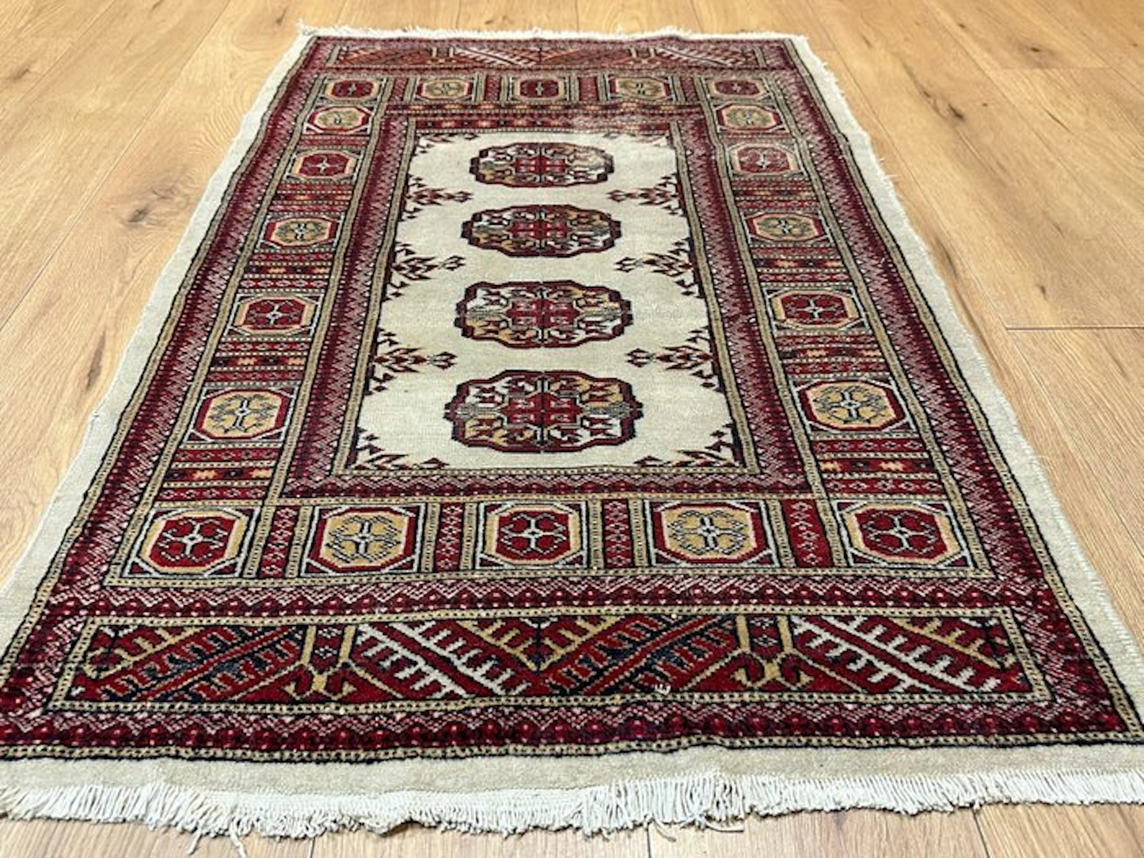 Hand-knotted Pakistani Bukharan Oriental rug with a...