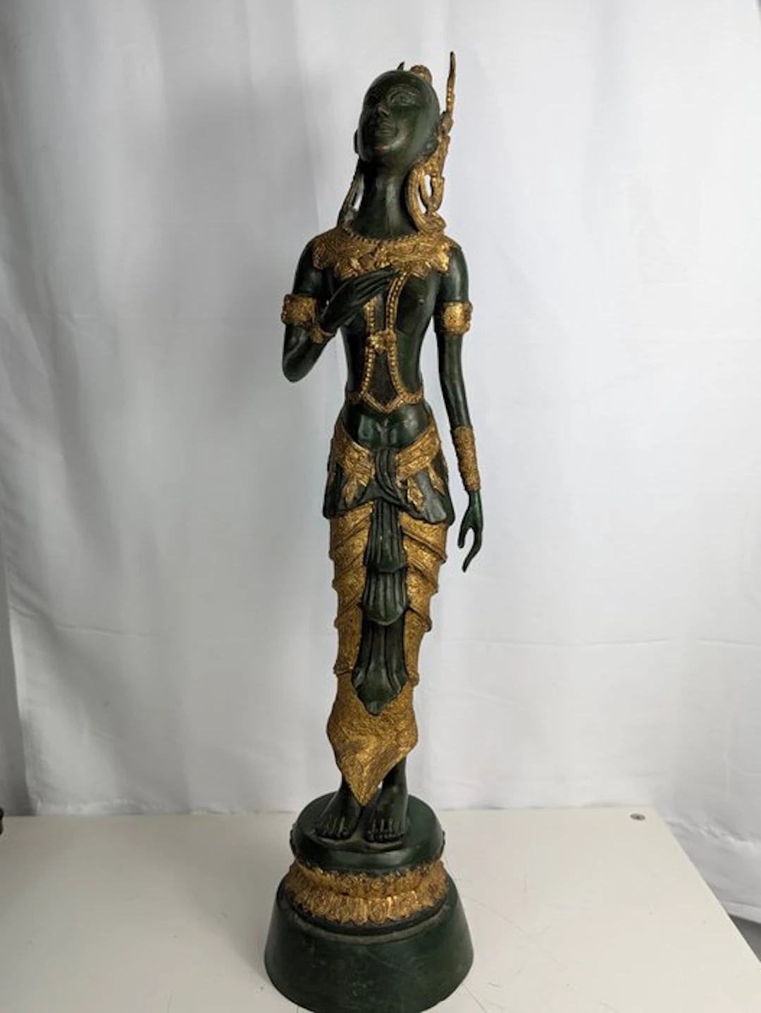 Large Thai Thepphanom bronze figure – green patina and...