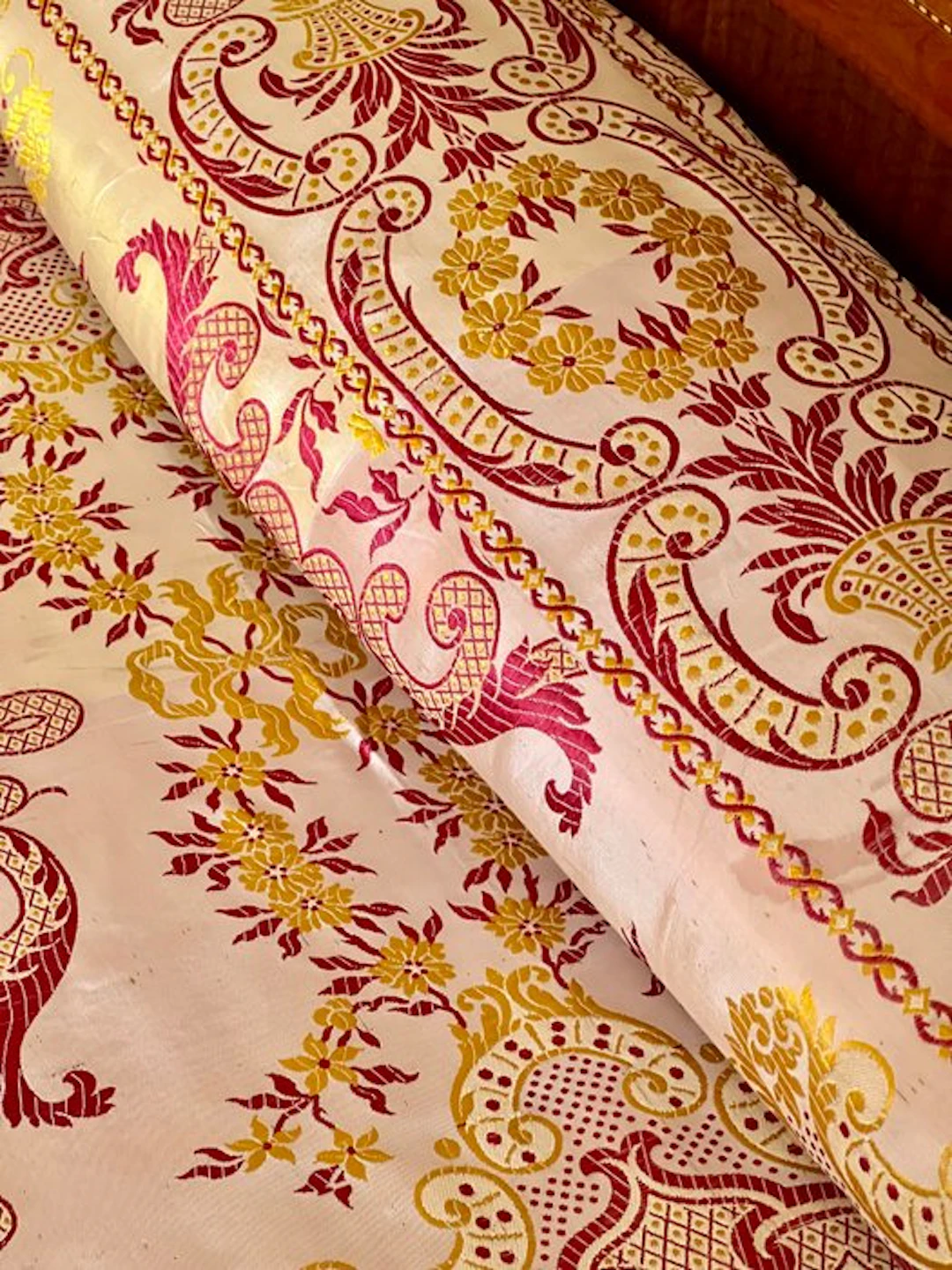 ** Antique silk bedspread with a Baroque print