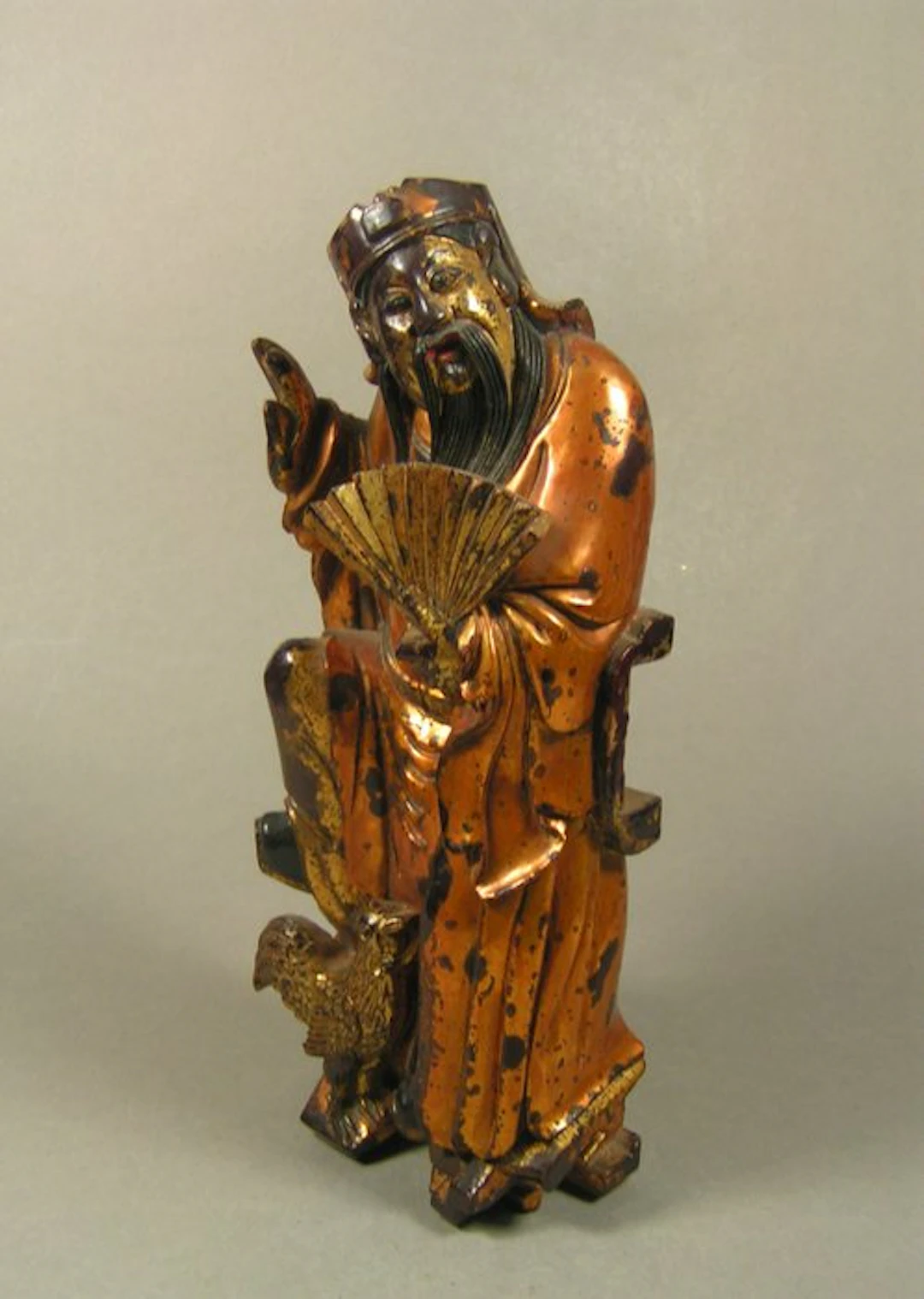 A Chinese gilded and red and black lacquered wooden...
