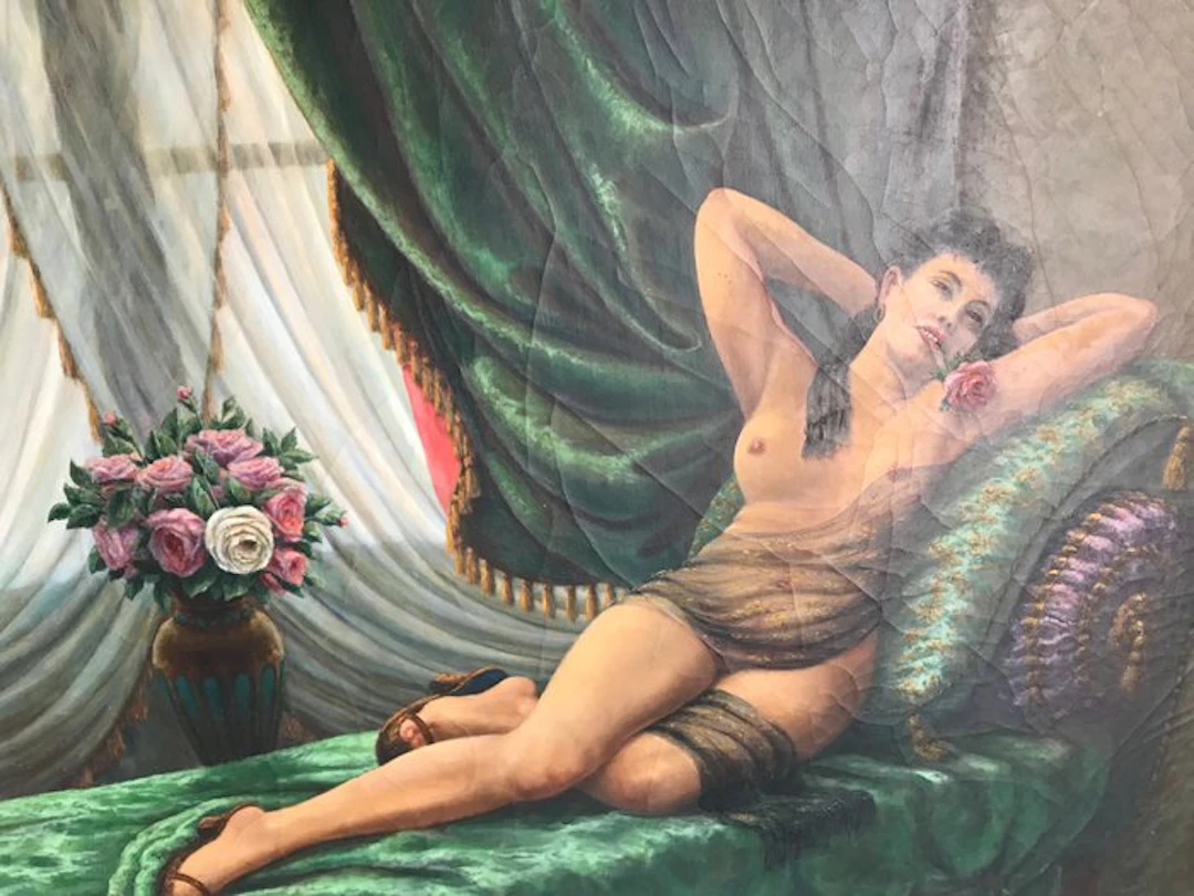 M. Perrot (XX) - Femme à la rose sur un divan vert