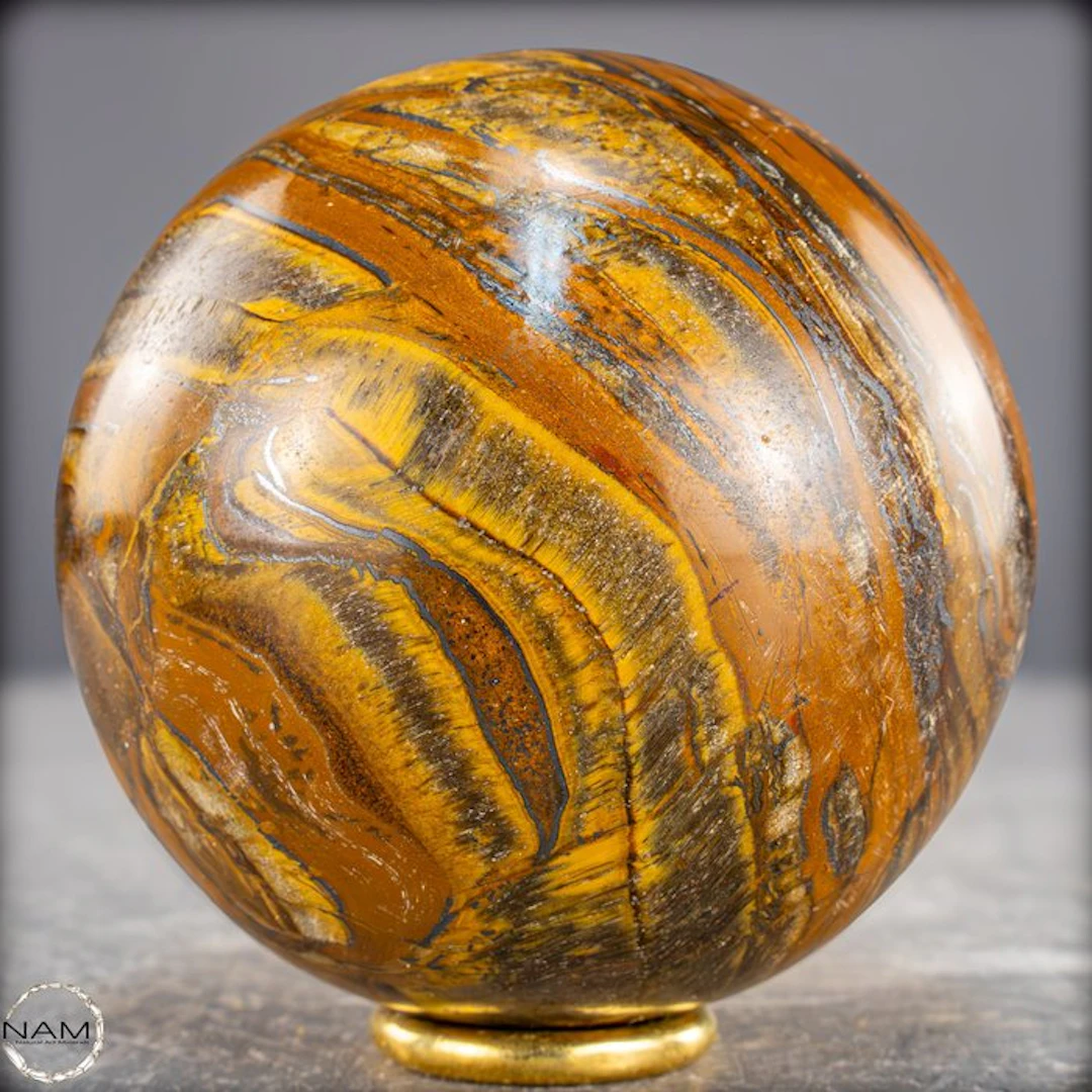 Natural tiger's eye sphere – intense gold veins with a lively shimmer- 661.18 g