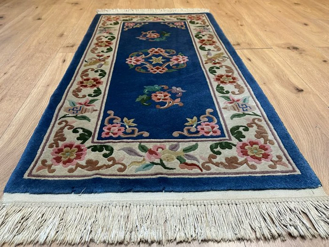 Beautiful Peking rug from China with floral medallions and a regal blue