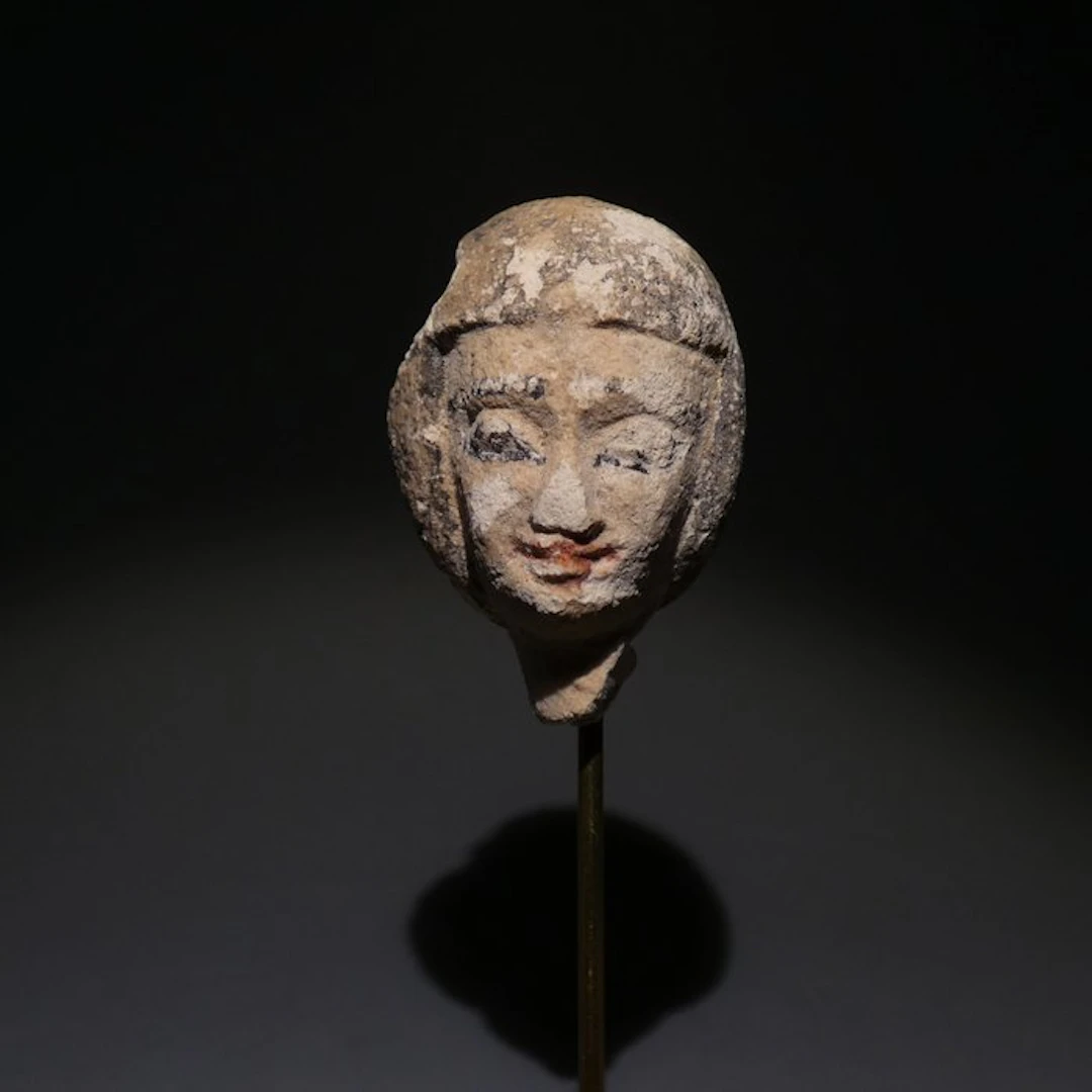 Ancient Egyptian Limestone Concubine head. 3,2 cm H. Late Period, 664 - 332 BC