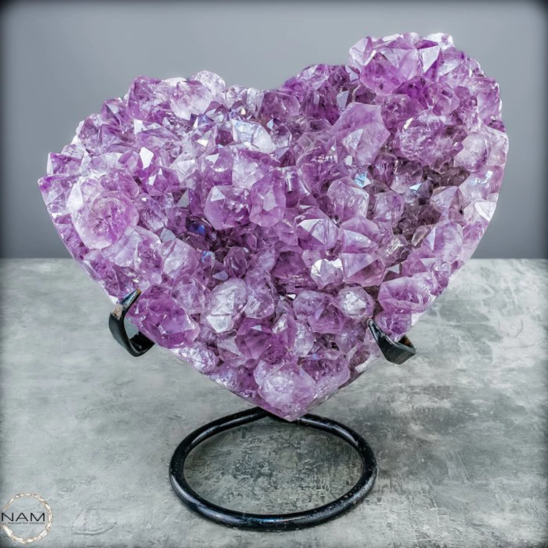 Radiant amethyst heart on a metal stand – An eye-catching...