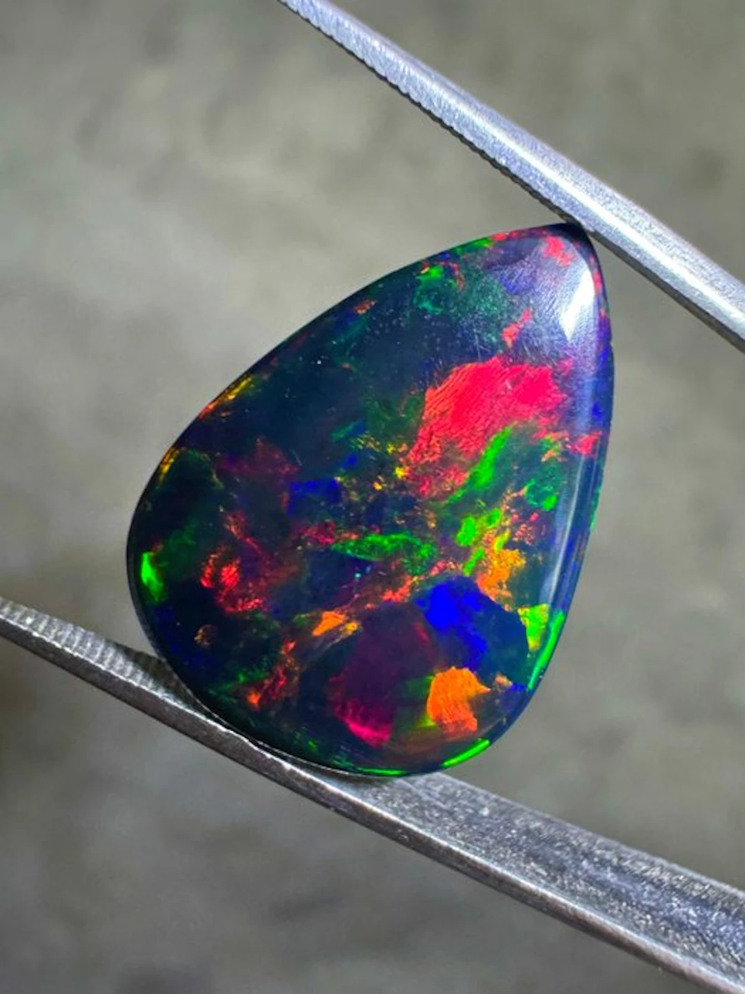 Top quality! Ethiopian black opal. 8.65 carats. pear-shaped cabochon- 1.73 g