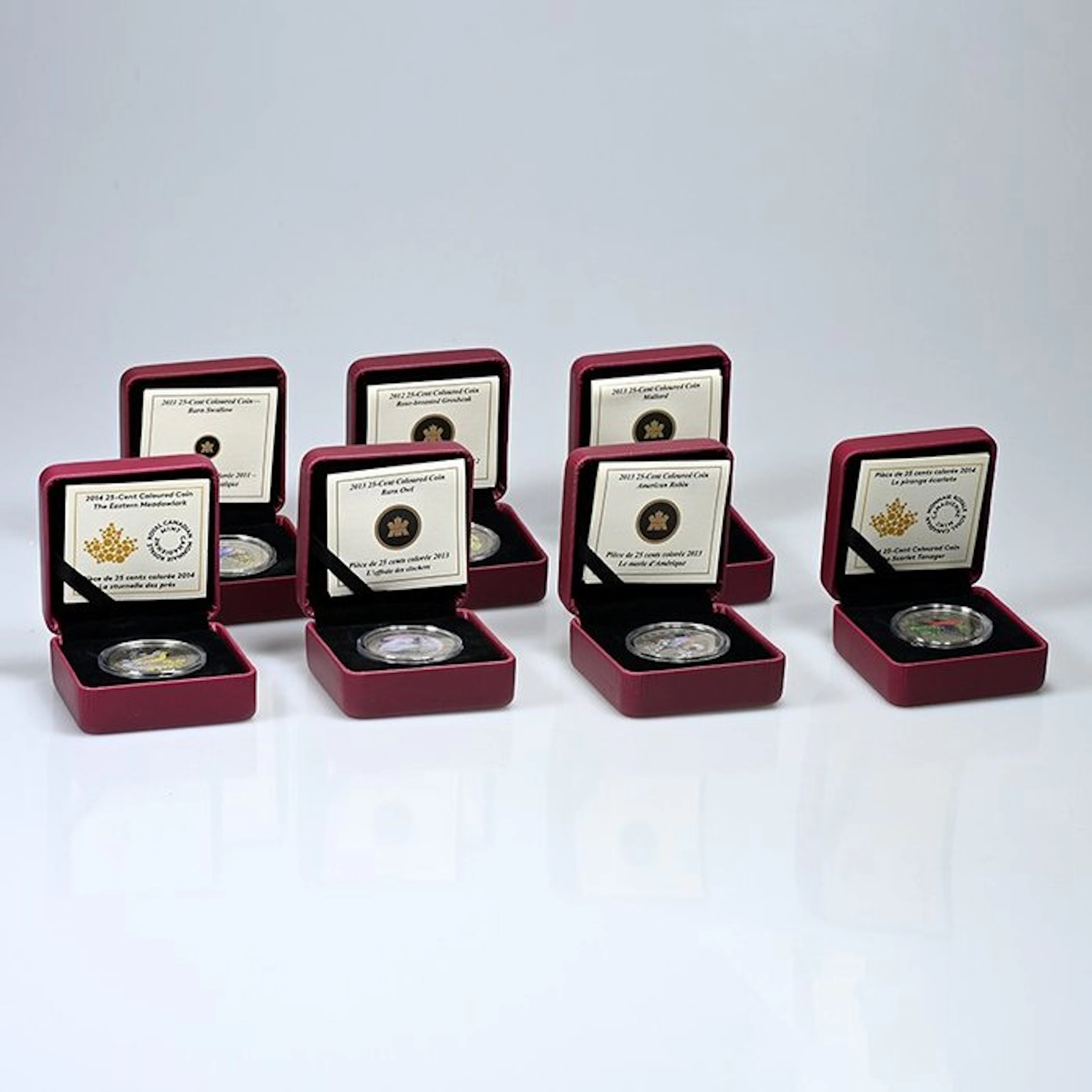 Canada. 25 cents 2011/2014, 7 x Colored Coins, Box & COA (No reserve price)