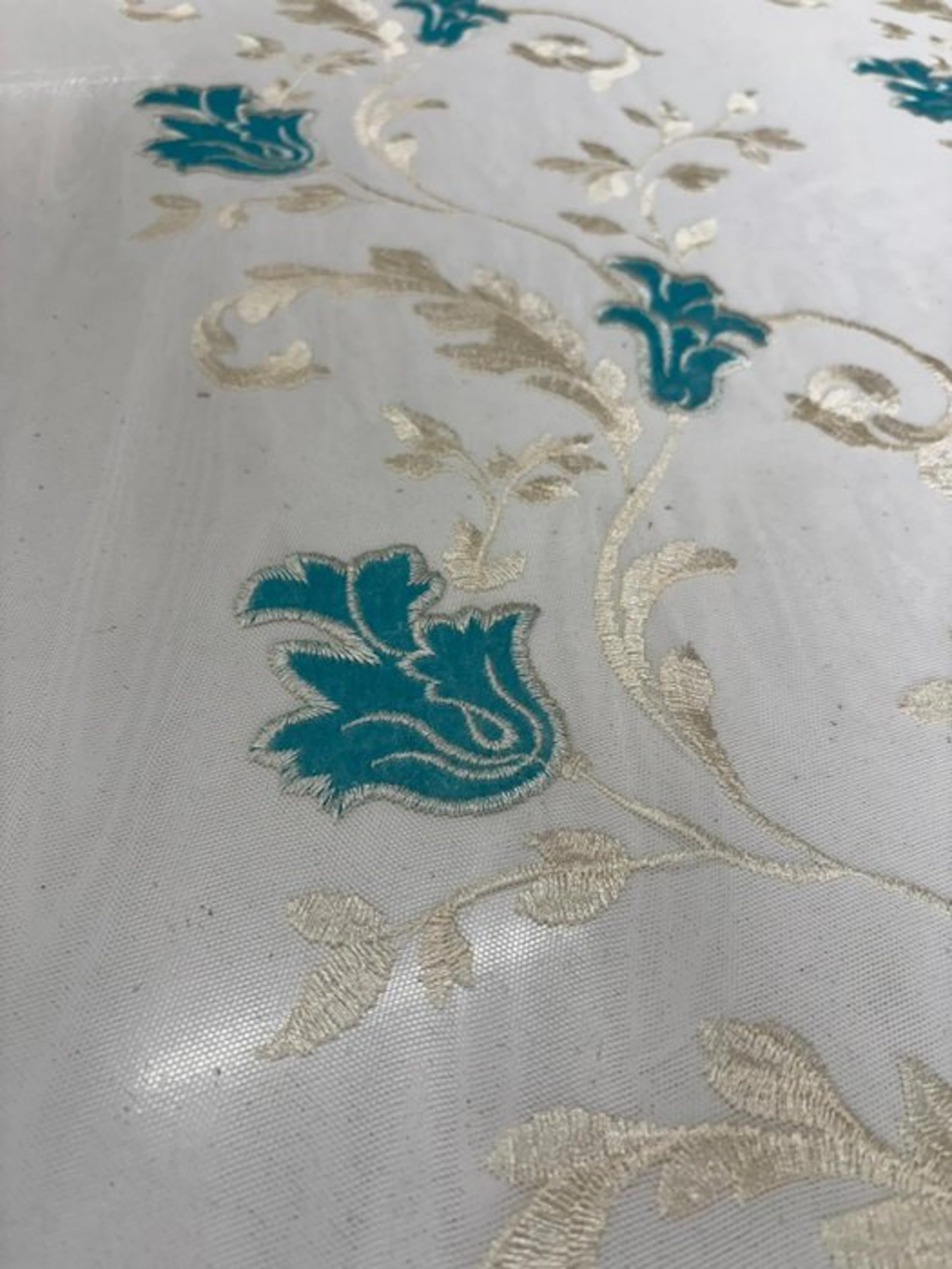 Precious drapery fabric: French-embroidered tulle with a...