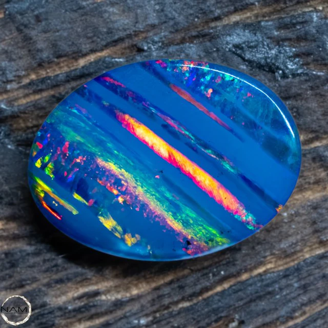 Triplett-Opal with glowing color veins – expressive blue...