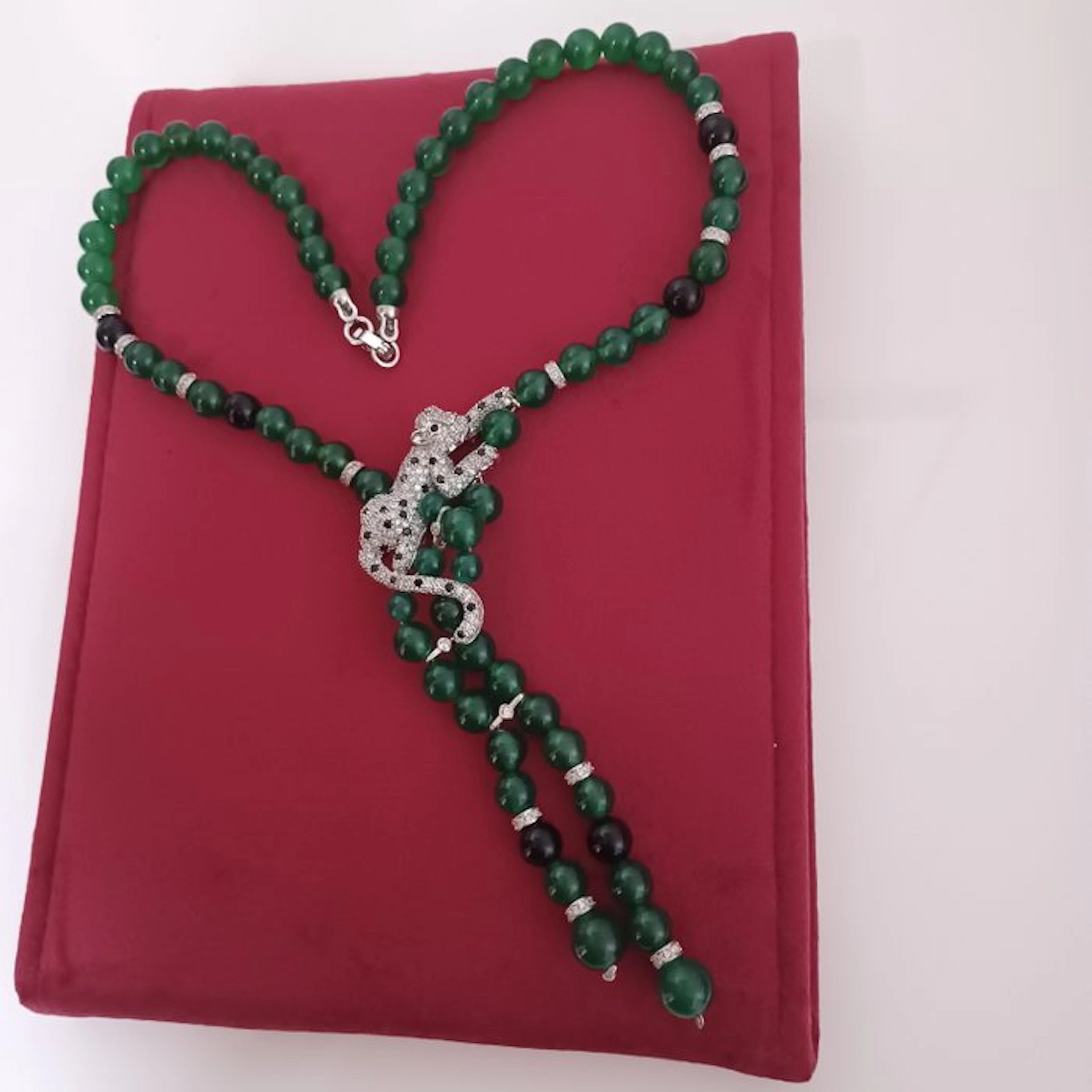 Green and black agate bead necklace with a pendant in the shape of a panther