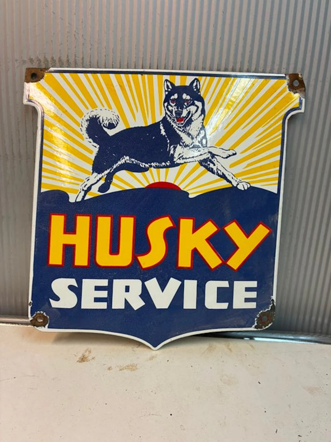 Husky Service – Decorative enamel advertising sign with a...
