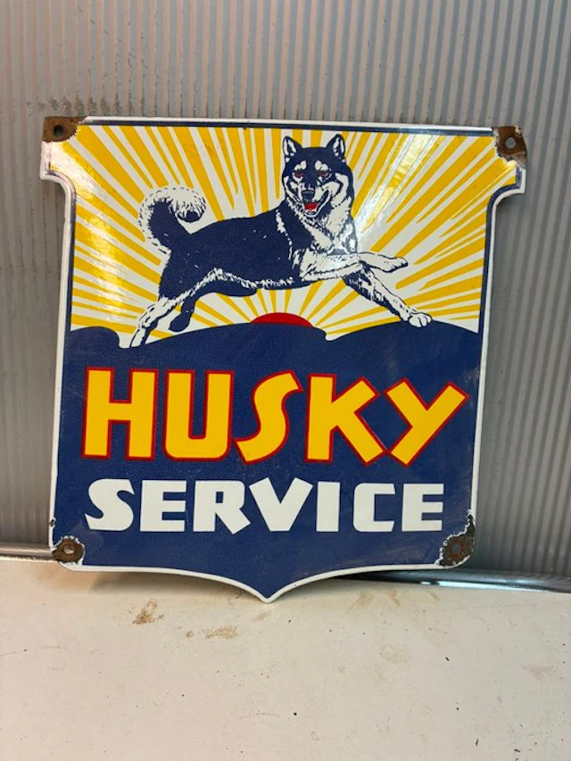 Husky Service – Decorative enamel advertising sign with a...