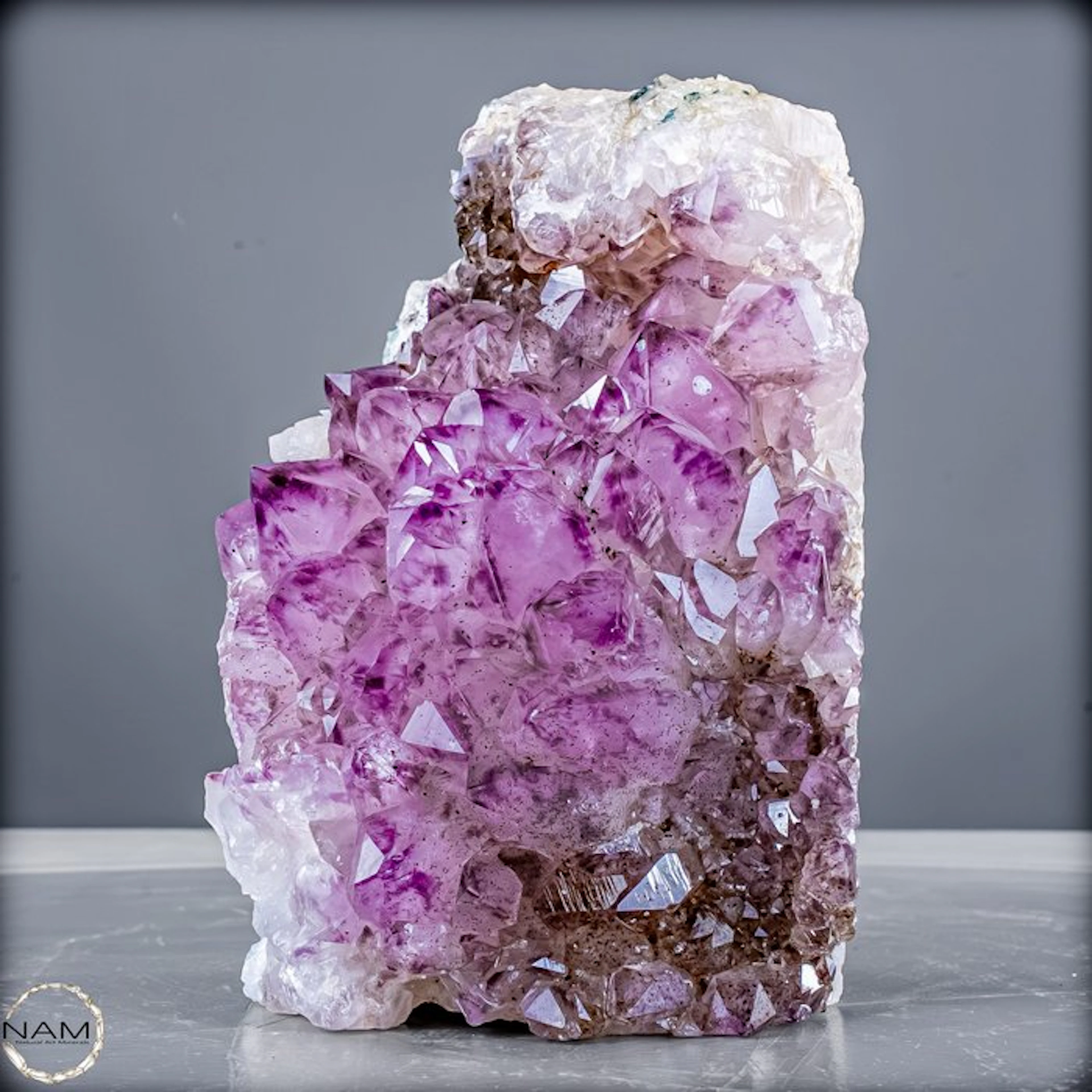 Amethyst druse with striking quartz crystals and...