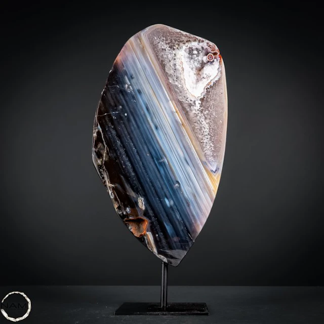 Natural agate slice with chalcedony and crystal druse on...