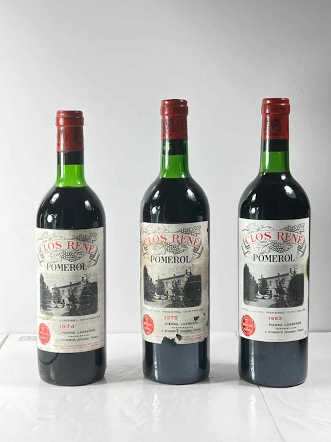 1975 , 1974 & 1983 Clos René, Pierre Lasserre - Pomerol - 3 Bottles (0.75L)