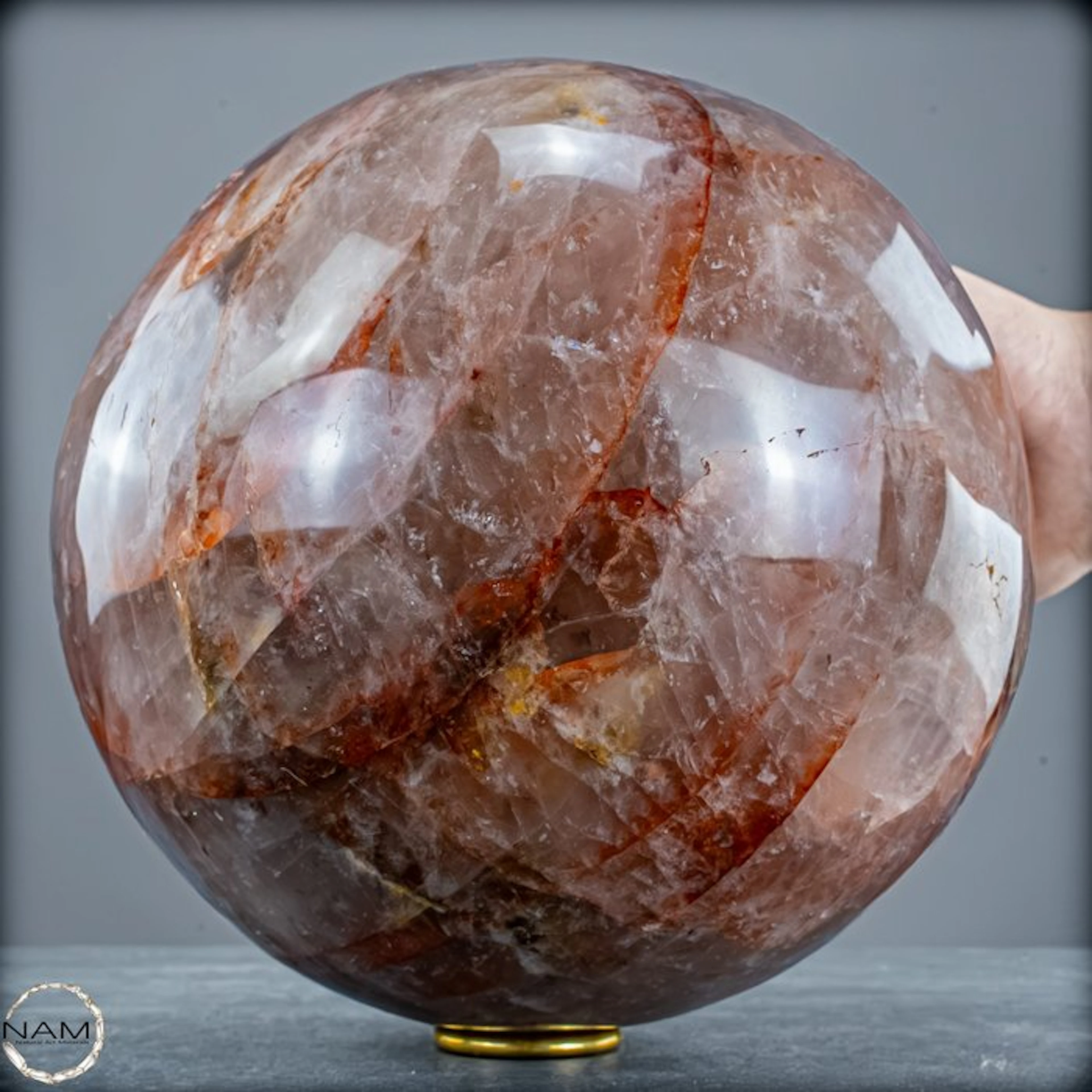 Breathtaking fire quartz sphere – fascinating red mineral veins