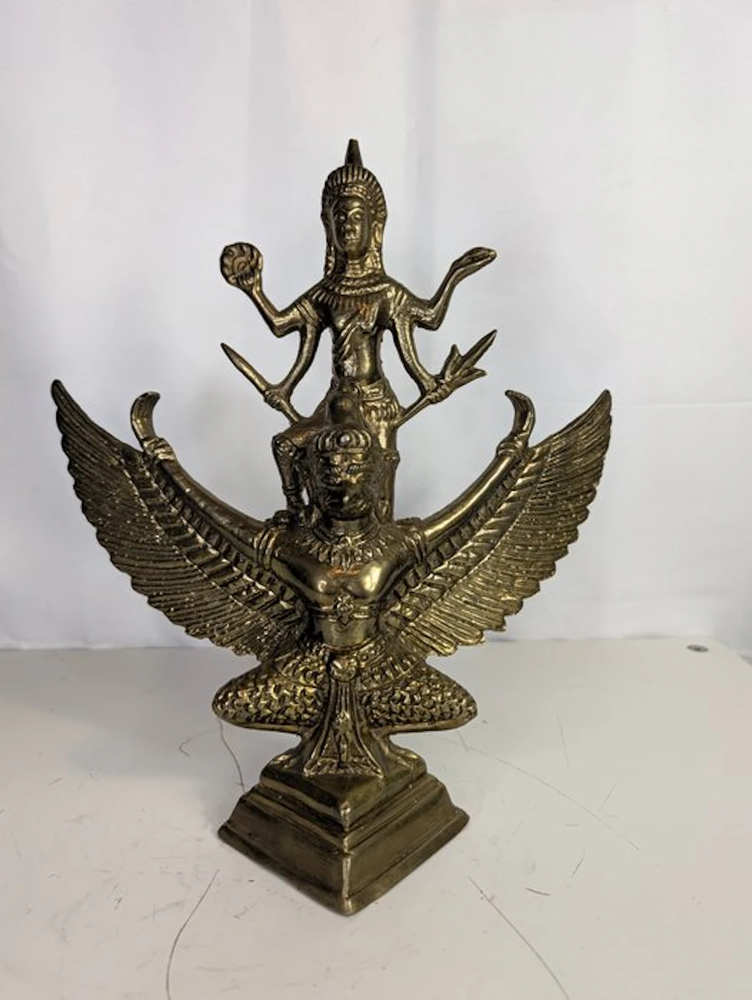 Bronze figure of Garuda with a multi-armed deity –...