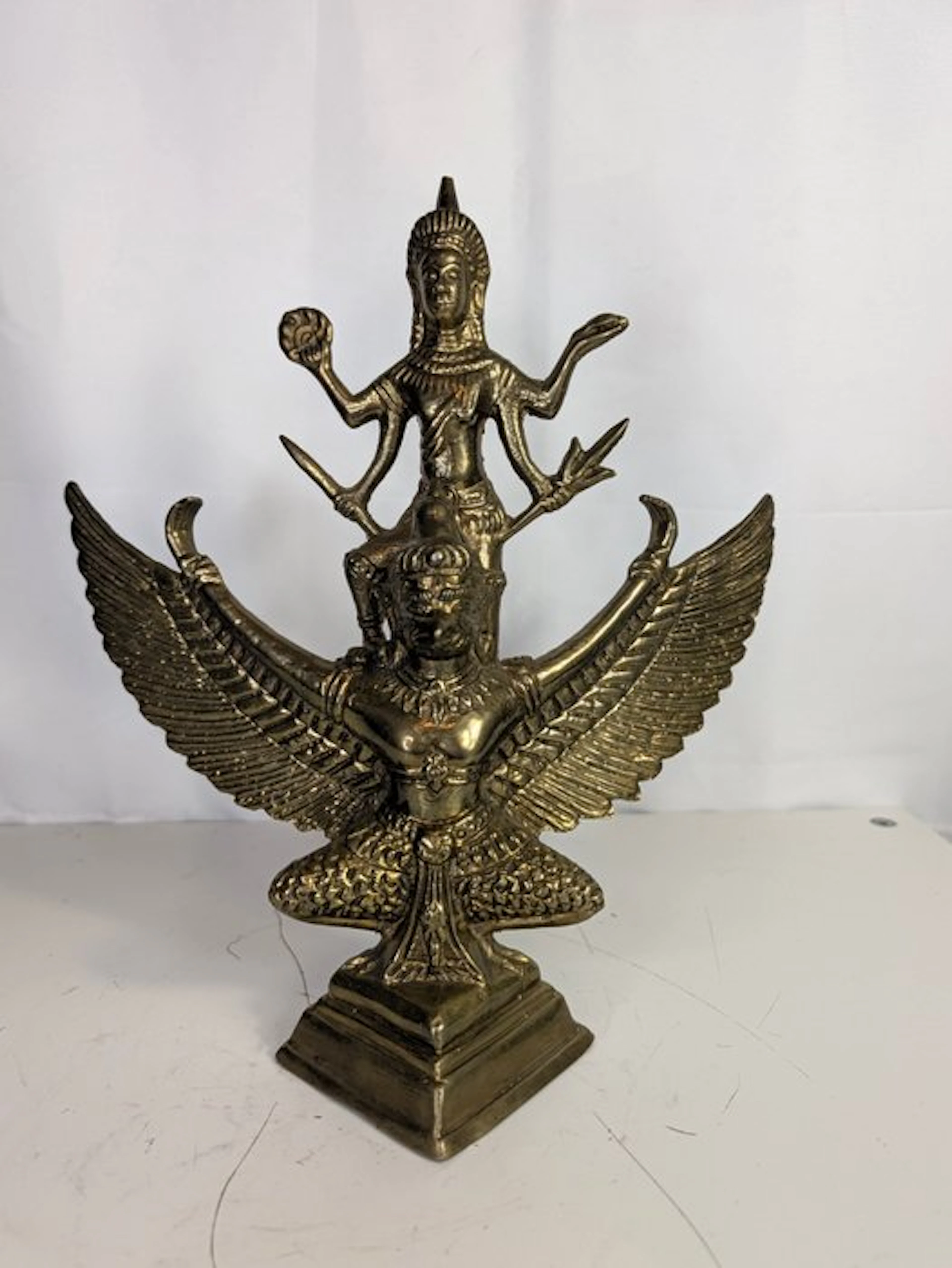 Bronze figure of Garuda with a multi-armed deity –...