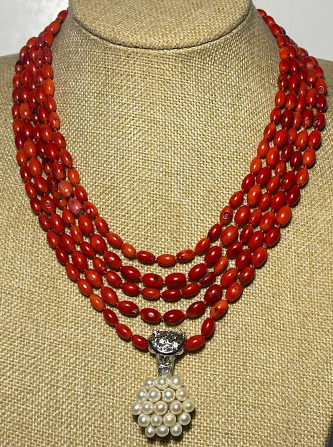 Natural red coral with a pendant featuring freshwater white pearls