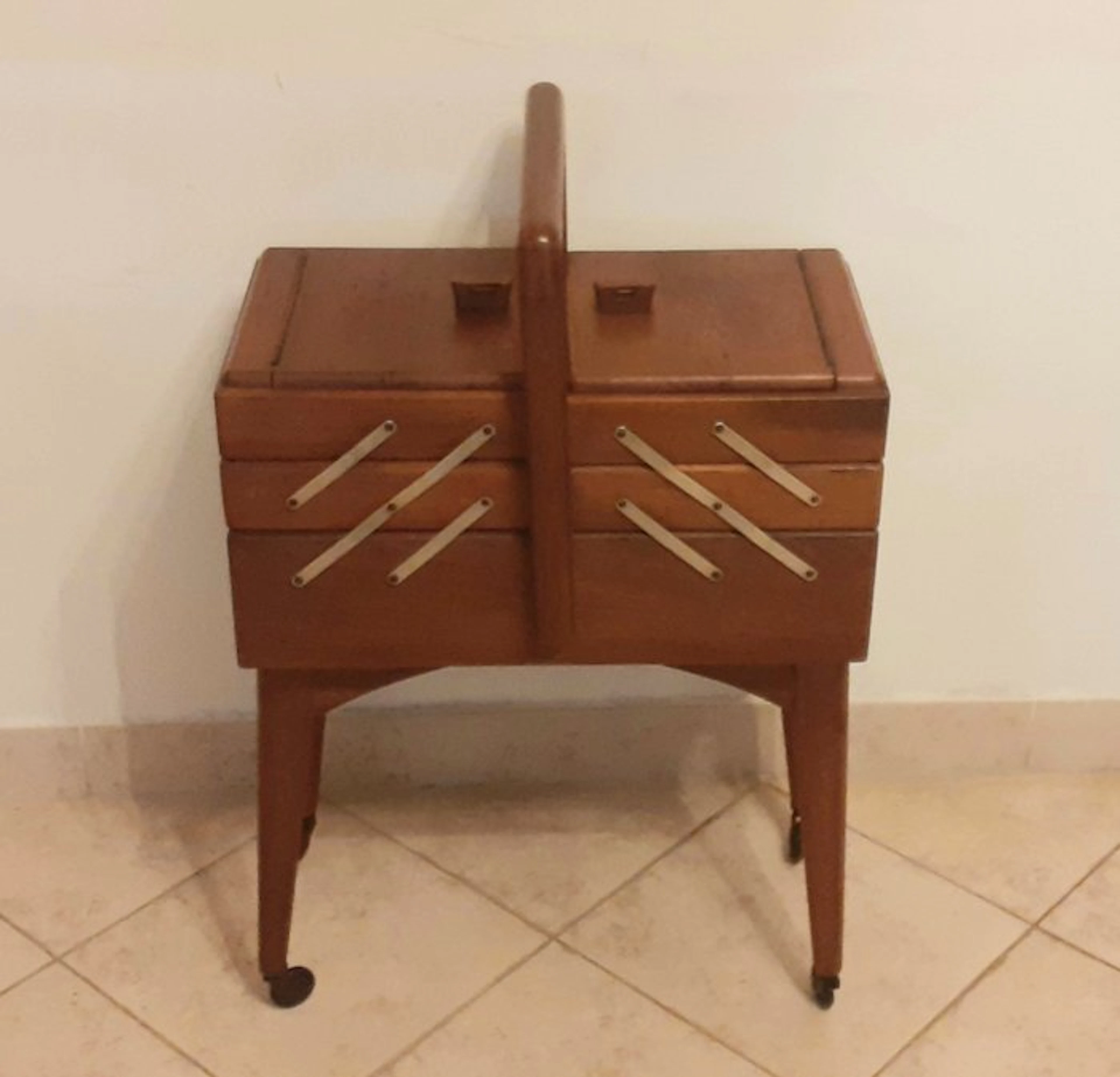 Cabinet - reclosable drawers with small metal wheels