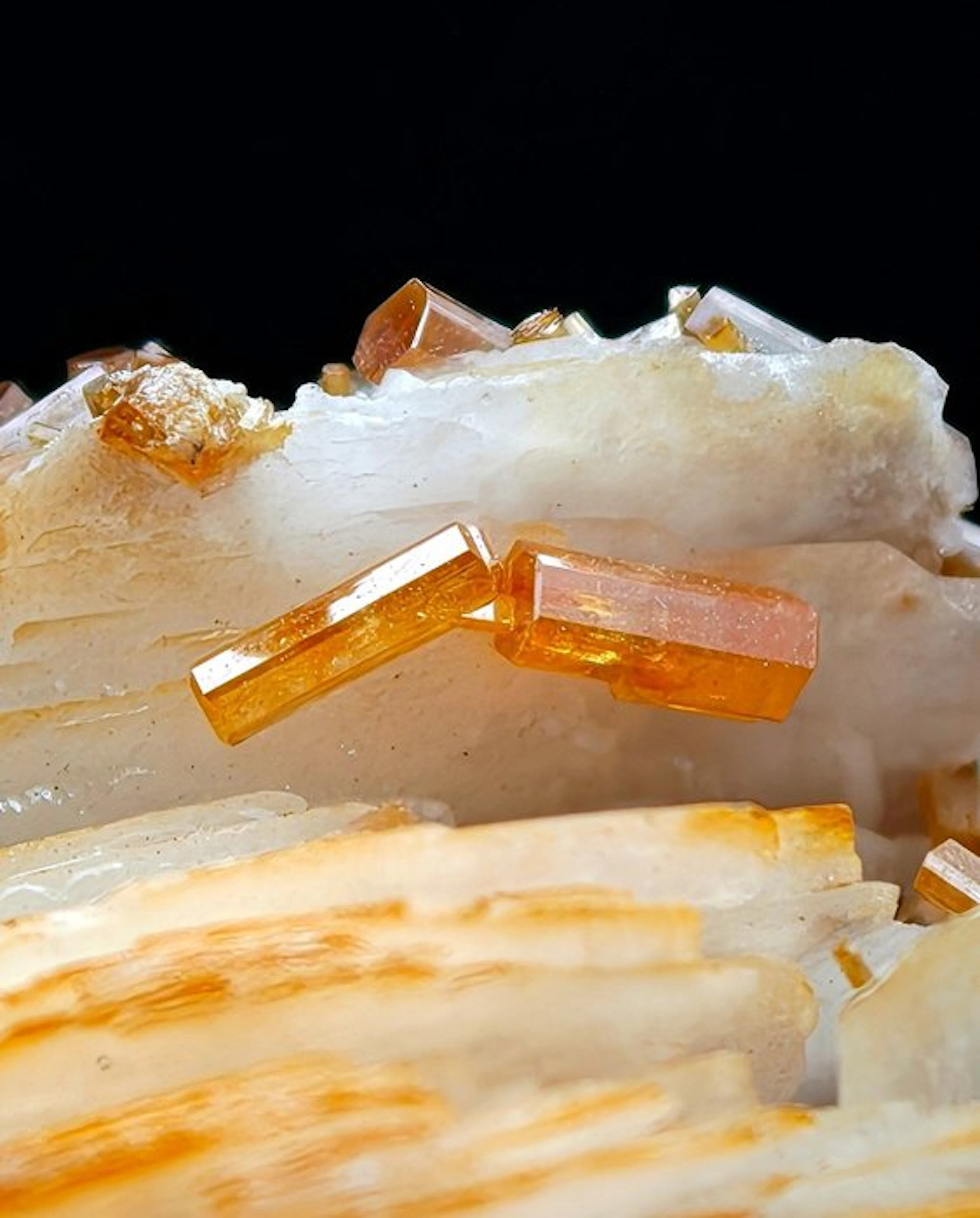 Orange vanadinite aesthetic on white barite blades
