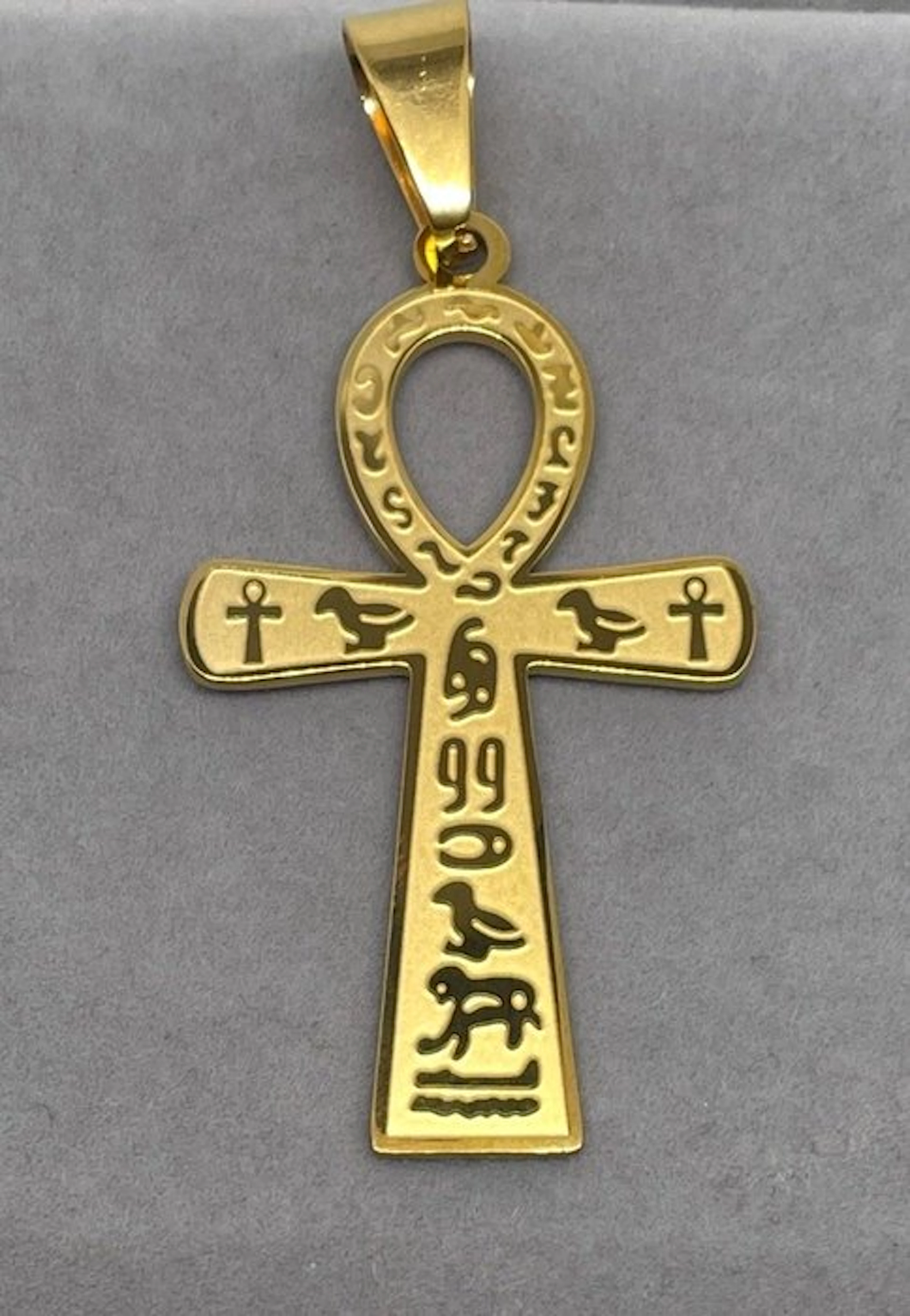 An Egyptian ankh plated in 18-karat gold – a symbol of...