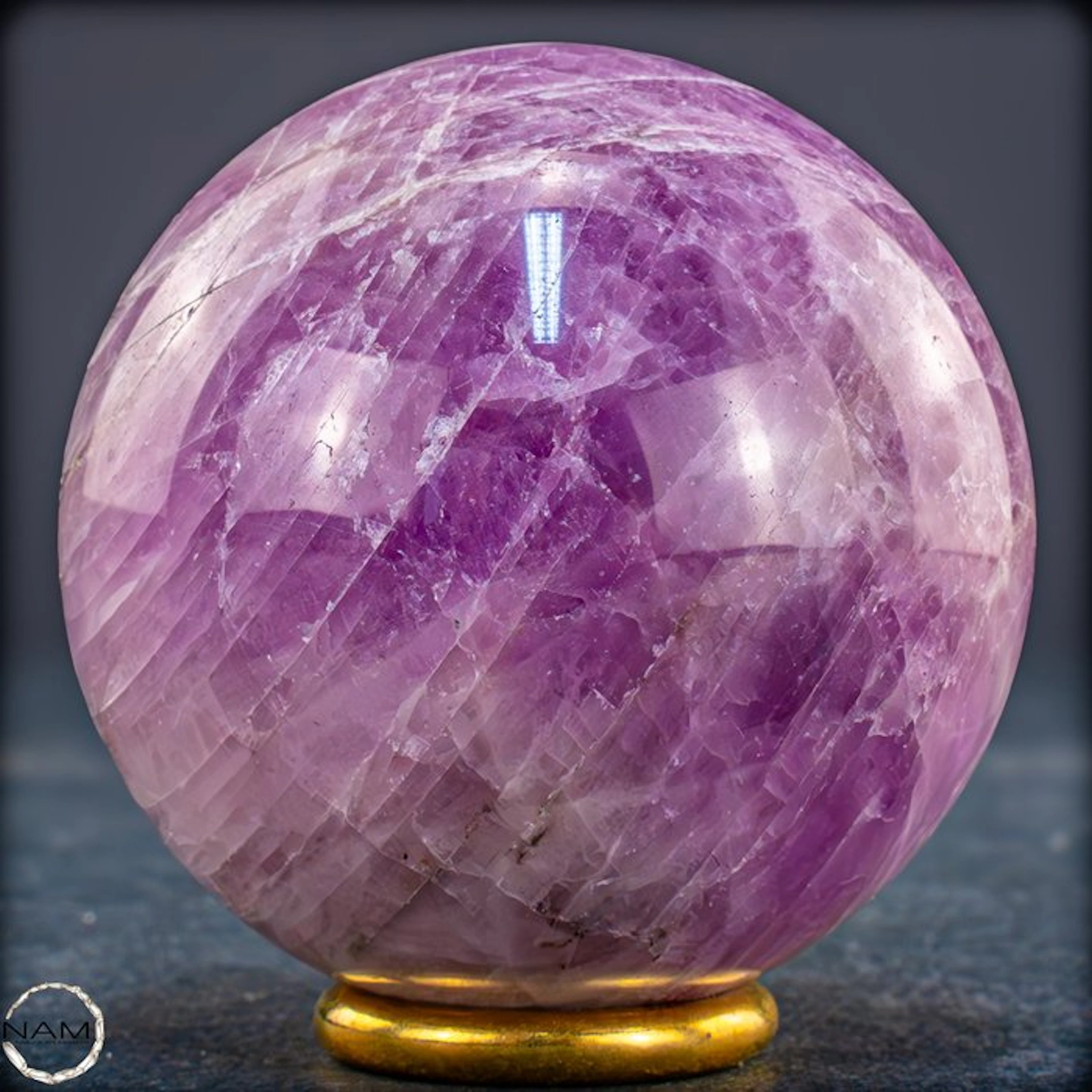 Majestic kunzite sphere with a fascinating cat's-eye...