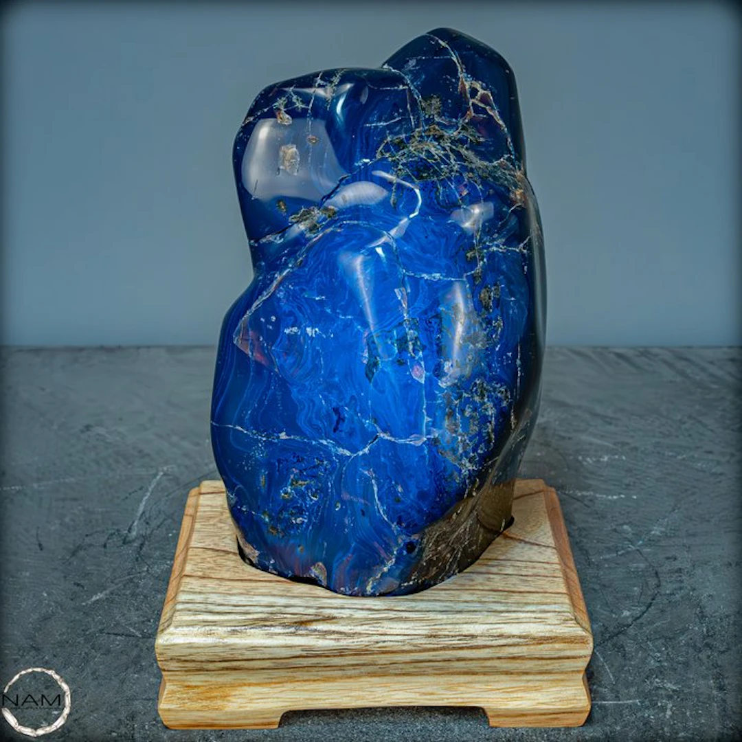 Amazing Natural Red / Blue Amber Freeform on Stand- 1545.66 g