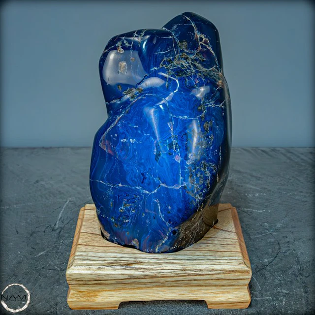 Amazing Natural Red / Blue Amber Freeform on Stand- 1545.66 g