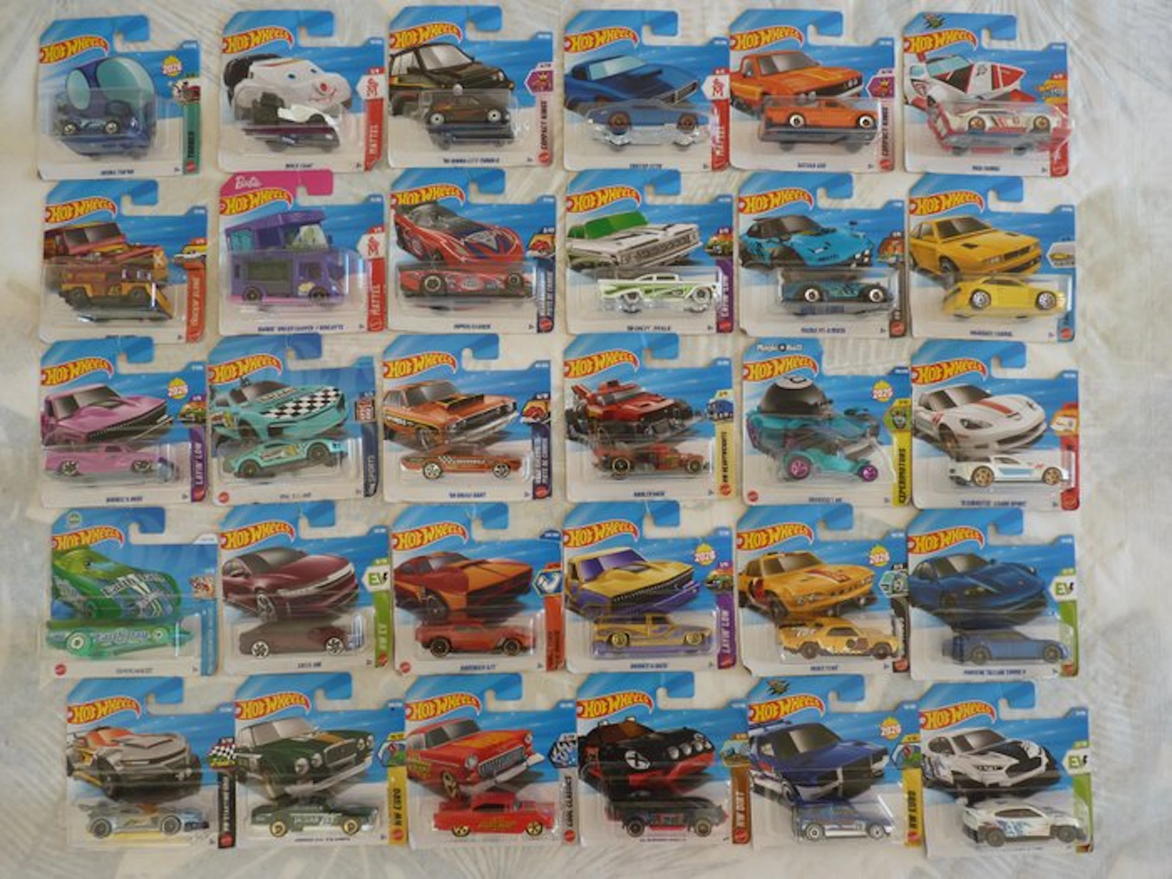 Themed collection - 30 Hot Wheels die-cast toy cars in blister packs.