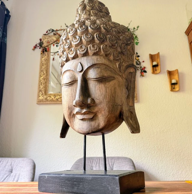 Large Balinese Buddha head carved from solid wood on a...