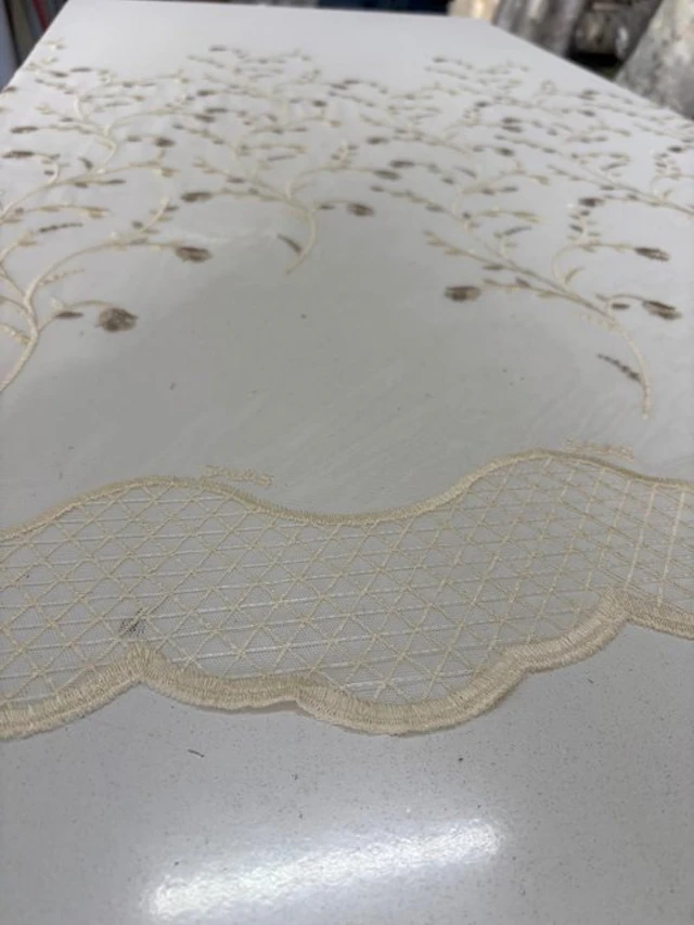 Precious Drapery Fabric: French-embroidered and edged tulle at the base