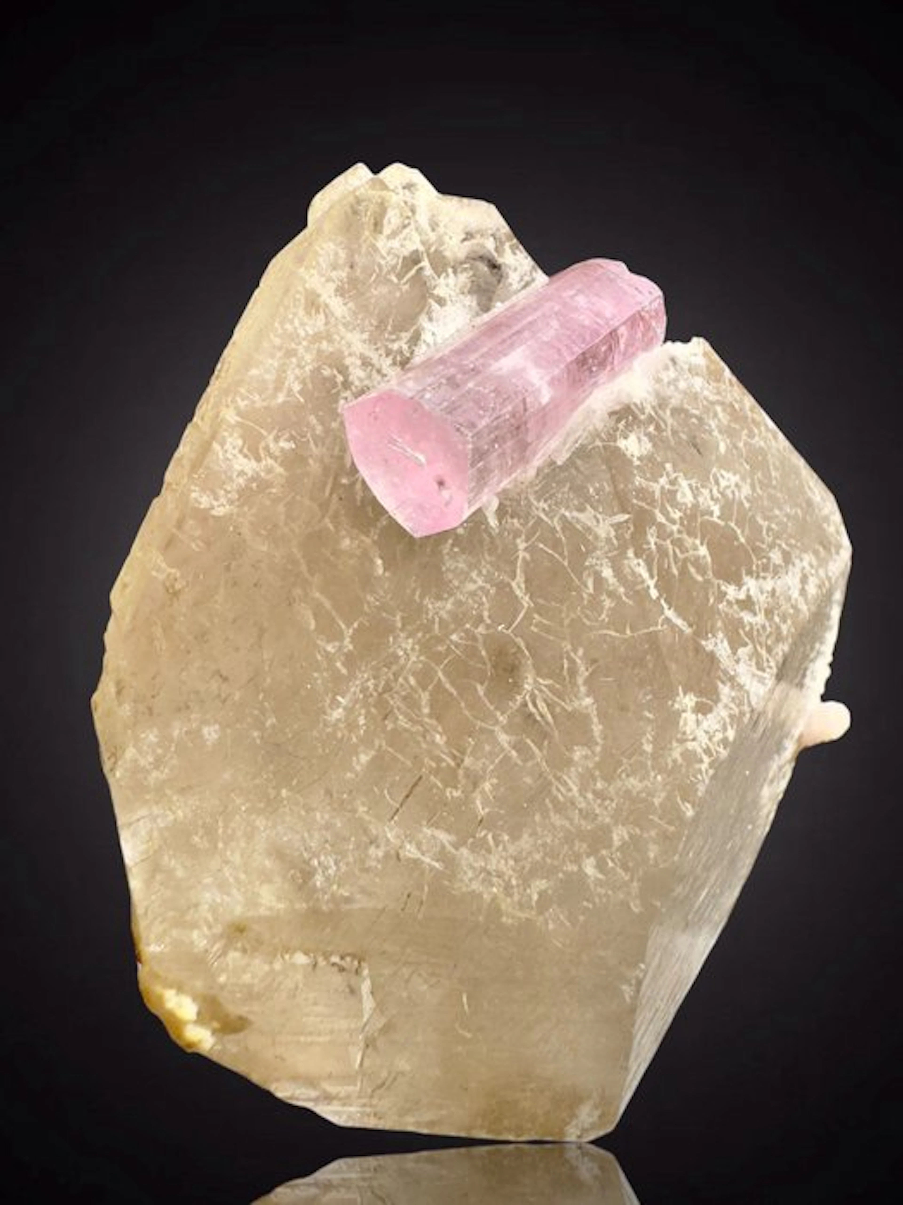 Pink tourmaline gemstone on quartz