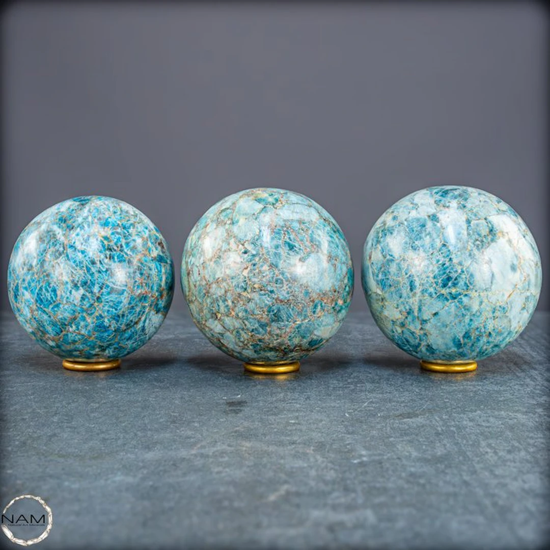 Natural apatite spheres – Set of three spheres in intense...
