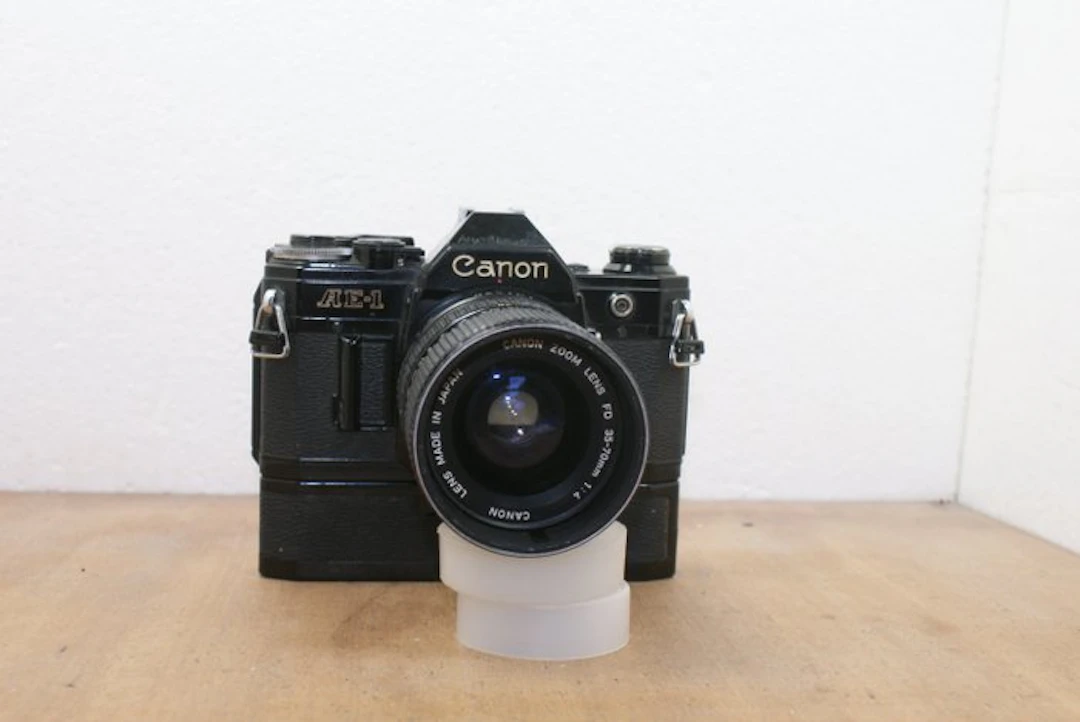 Canon AE-1 + FD 1:4/35-70//Canon Power Winder A Single lens reflex camera (SLR)
