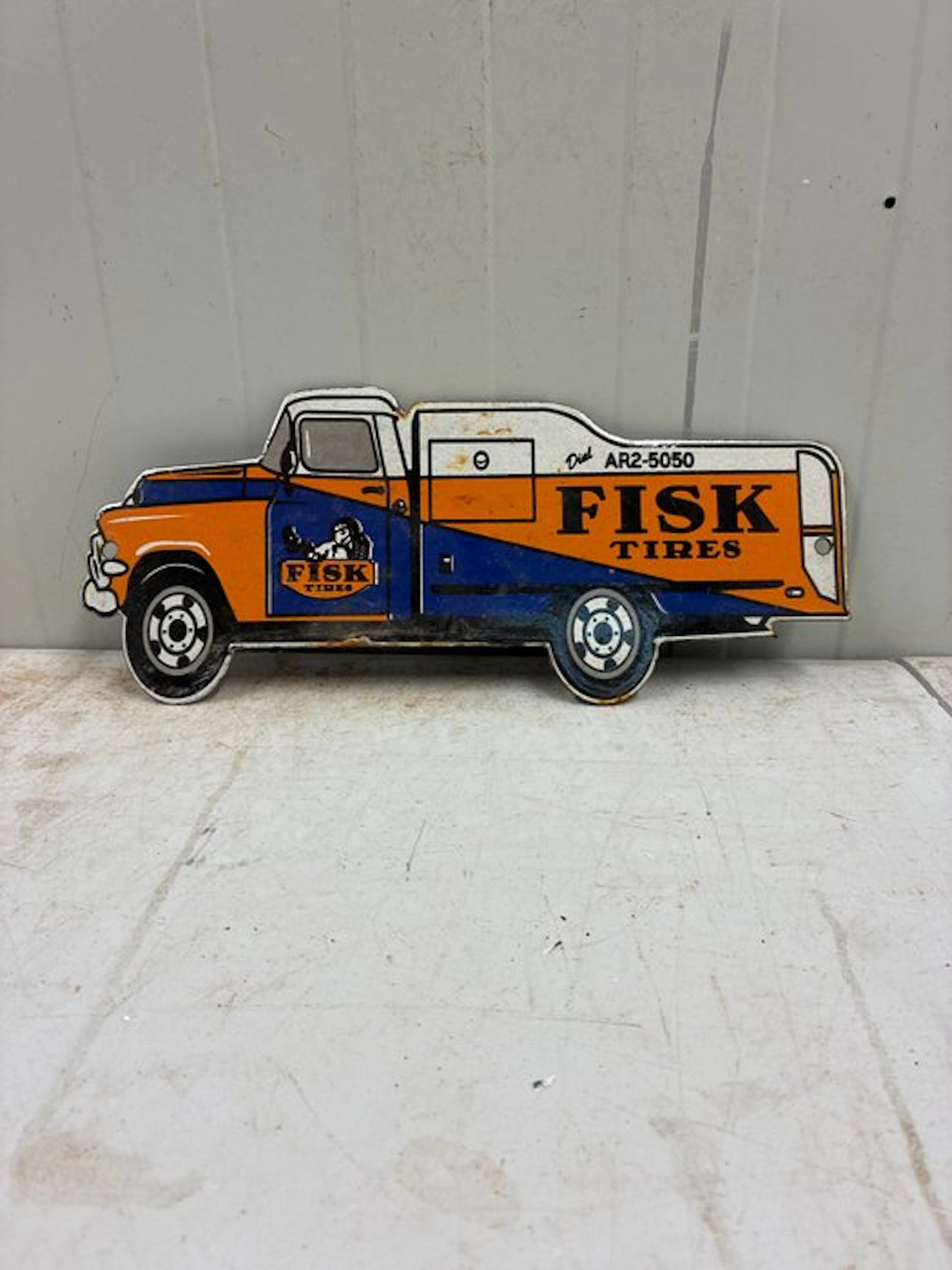 Fisk Tires – Pick-up Truck – Die-cut enamel advertising...